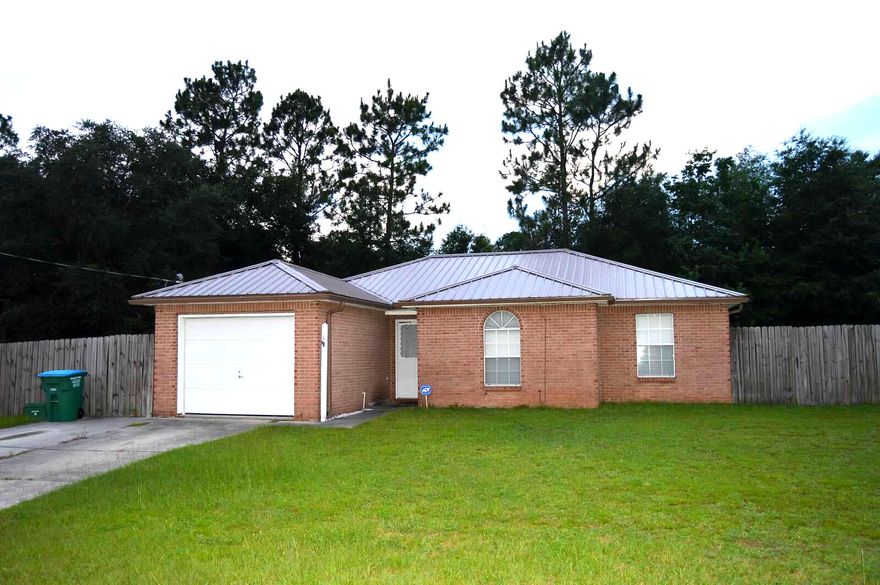 Beautiful home on corner lot in quiet neighborhood! A third of an acre is the perfect setting for this three bedroom, two bath, very well maintained home. Wood laminate in living areas, tile in wet areas and carpet in bedrooms. Upgraded stainless steel appliances in the kitchen. Screened in Florida room for evenings in the large back yard. Two sheds in back yard as well as washing machine and dryer convey without warranty. New roof in 2014, laminate in 2011, lift station in 2014, a/c in 2011. This home is in excellent condition!