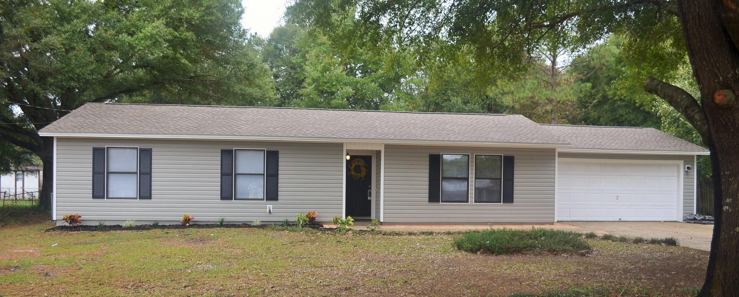 Beautiful 3 bedroom, 2 bath home that has been completely remodeled. Features laminate flooring in all main living areas, tile in bathrooms and brand new carpet in bedrooms. Kitchen has all brand new stainless steel appliances, mosaic back splash and new counter tops. All rooms are good sizes and have great closet space. All new vinyl siding on the exterior, NEW roof, and a HUGE, flat backyard. The Fence, window screens, and master bedroom closet doors will be installed by end of month (on order).
