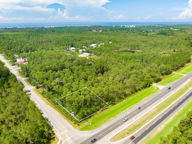 Great Village Mixed Use location on West end of US Hwy 98 and the corner of Thompson Road. Easy access off Hwy 98 and Thompson Road. Two new subdivisions are currently being built on Thompson Road. 128.89 feet of Hwy 98 frontage and 280 feet deep. The lot is .47 acres. Combine it with the lot to the west of it and you have 291 more front feet on Hwy 98. Flood zone X and no apparent wetlands.