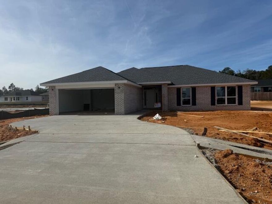 This single-story home offers a spacious layout that will make a family of any size comfortable. Upon entering from the covered front porch there is quick access to the kitchen or keep walking towards the great room. The main living area is centrally located and boasts an open and seamless arrangement. This creates the perfect atmosphere to host an evening and entertain friends and family. The master suite is tucked away from the dining room and offers a well-appointed ensuite bathroom with a double vanity and generous walk-in closet space. The additional rooms are thoughtfully placed on the other side of the home so all family members or guests can enjoy a certain level of privacy. The concrete patio extends your living space outside and provides a great spot for enjoying