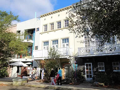Gigi's Getaway townhouse located in Ruskin Place Artist Colony in the heart of Seaside. Lovely quiet park setting. Situated between the architecturally stunning Seaside chapel and the main shopping/restaurant area and, of course, the emerald waters of the gulf coast! Very short walk to the sugar white sand beach. This home is three levels plus spacious roof deck with masonry exterior. Ground level includes retail with half bath that can be converted into an additional 5th bedroom and full bath. Entry hall and staircase provides easy access to and from the adjoining Ruskin Place Park with unique shops. Also on ground level is one bedroom with private bath and private entry. Second level offers two separate but adjacent living areas. Gulf views from the roof deck. Owner occupied.