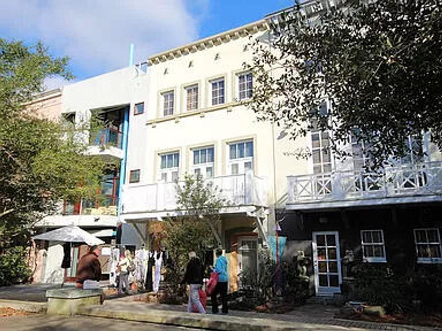 Gigi's Getaway townhouse located in Ruskin Place Artist Colony in the heart of Seaside. Lovely quiet park setting. Situated between the architecturally stunning Seaside chapel and the main shopping/restaurant area and, of course, the emerald waters of the gulf coast! Very short walk to the sugar white sand beach. This home is three levels plus spacious roof deck with masonry exterior. Ground level includes retail with half bath that can be converted into an additional 5th bedroom and full bath. Entry hall and staircase provides easy access to and from the adjoining Ruskin Place Park with unique shops. Also on ground level is one bedroom with private bath and private entry. Second level offers two separate but adjacent living areas.  Gulf views from the roof deck. Owner occupied.