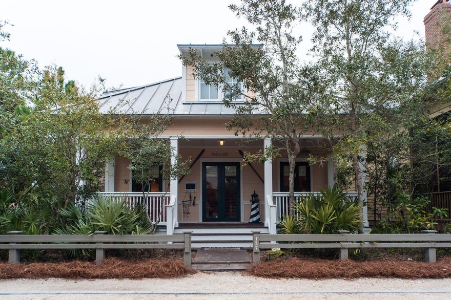 Imagine listening to the waves while relaxing on the front porch of this charming WaterColor cottage, while you are only a five minute walk to the beach and the gulf front Beach Club. Beautiful pine floors carry throughout this home whose cottage panel wainscoting creates an authentic Old Florida beach atmosphere. A spacious, open floor plan seamlessly connects the living area with the kitchen with stainless steel appliances whose perimeter cabinets and center island are adorned by granite counters. A spacious master is located at the rear of the home which backs up to the very private Sunset Ridge Lane. The master bath features a walk-in shower as well as two large vanities.