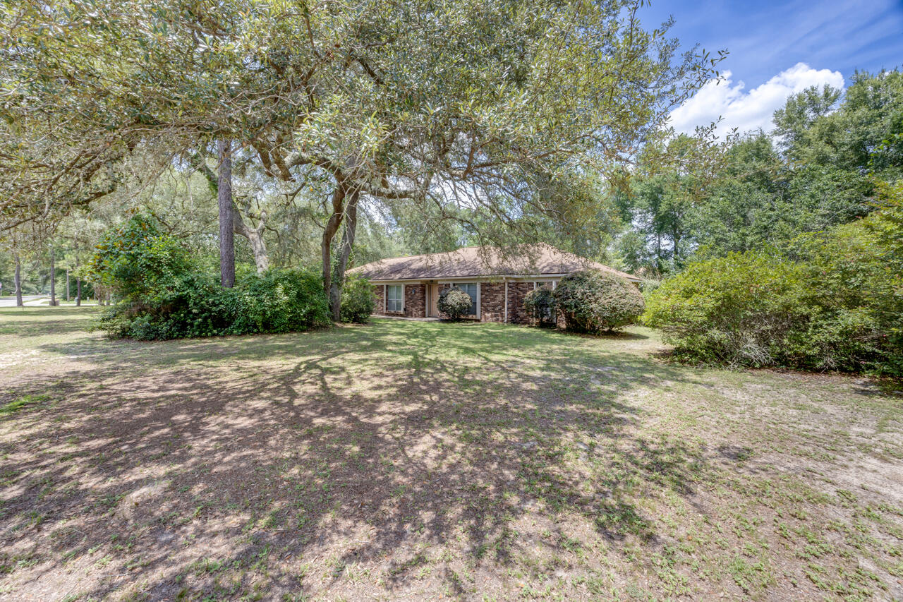 Looking for a hidden gem to transform? Look no further! This 1 owner home in Rocky Bayou has endless potential- with the right vision it will be the perfect place to call home! Features include whole-house Generac system, hurricane shutters, gas fireplace, sprinkler system. Formal dining room, plus 3 additional living spaces, including over 500 sqft of heated and cooled space wrapped with windows- a wonderful place to enjoy your morning coffee! Right in the heart of Niceville, this is a hidden gem! Roof, HVAC 2011.