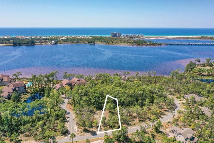 Build your dream home! This .41 acre lot backs to a conservation area and is only a short bike ride to Lake Powell and many amenities. Opportunity awaits you in the beautiful gated community of Wild Heron, a 734-acre Coastal Sanctuary, located on the shores of Lake Powell, Florida's largest coastal dune lake. Experience the fitness center, heated pool and hot tub, a boat house for storing kayaks and paddle boards, community dock, fire pit and gathering area with fireplace, all overlooking Lake Powell. A stunning family park that features many types of fun filled family events are a favorite, along with 24 miles of walking and bike paths linked to the amenities for the convenience of those who call it home... The white sandy beaches of the Gulf of Mexico await you only a short kayak paddle away across the lake. 30A, Rosemary and Alys Beach, are a few minutes' drive to world class dining, grocery stores and shopping as well as Pier Park in Panama City Beach. Golf club and beach club memberships are available to purchase as well as access to the world renowned Greg Norman Sharks Tooth golf course, club house and hydro court tennis courts onsite right here at Wild Heron.