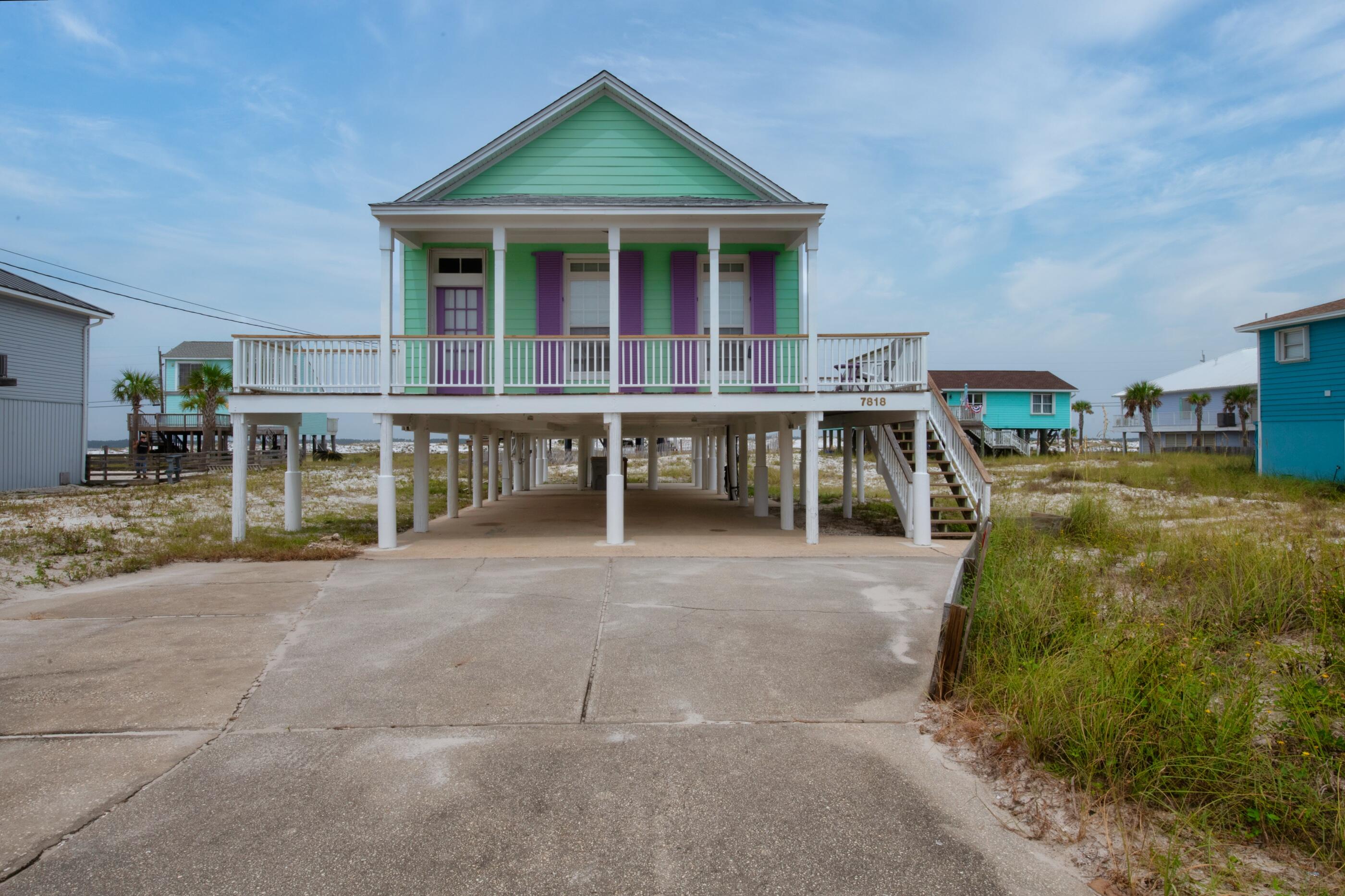 Open House on Sunday, September 12 from 12-3! Antique meets coastal cool in this 1940's-built home. This unique bungalow is furnished and filled with character from floor to ceiling with its original finishing details that lets you experience the old Florida lifestyle. Located between the sound and the Gulf, you will enjoy the best of Navarre Beach views from every room of the home. Throughout the home, you will be greeted by 11-foot ceilings, chic bead board paneling, original fireplace mantels, extensive molding that incorporates the bonus room complete with built-in bunk beds that will allow extra space for guests. The stylish living area consists of pine hard wood flooring and a cozy three-way fireplace that joins the living, kitchen, and formal dining area. In the kitchen, you will be graced with tall solid oak cabinets, granite countertops, backsplash and ornate tile detailing on the fireplace surround. In addition to the entry bonus room, this home boasts two bedrooms and two full baths, one being the master suite that is complete with corresponding ensuite and a private deck. Opportunities are endless in the one-of-a-kind villa that would be perfect for a primary, secondary or investment property. This home sleep 8. As well with the indoors, this home has an amazing outdoor space consisting of an abundance of parking, a large front porch perfect for rocking chairs and two decks for enjoying those serene sunsets. Life will be far from dull, as you can make the most out of your days taking your golf cart to the beach, enjoy a nightly stroll in the sand, fishing from Navarre's sought after pier, or enjoying a cold drink at Juana Pagodas. Call today for a private showing to see "Florida's most relaxing place".