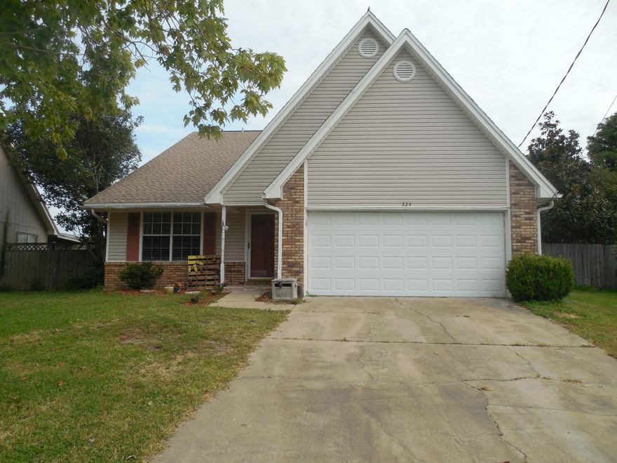 Price to Sell! Close to Hurlburt Field base..this home has been recently painted inside. Beautiful new maple laminated wood floors (see photos) in Living rm, hall & master bedroom. Living room has cathedral ceilings & gas fireplace. Kitchen/dining area & bathrooms has tiled floors. Bright kitchen has Stainless steel appliances with gas stove, side by side refirgerator, solid corian-like countertops & a built in pantry. Large Master bedroom downstairs. Loft area overlooks the living room could be used as an office. All bedrooms are spacious! Extra large bedroom upstairs with walk in closet and access to attic storage...lots of storage! Enjoy sitting outside in the screen porch outside. Oversized garage with shelving/peg board. Seller is a lisc agent. Don't wait....you will be too late!