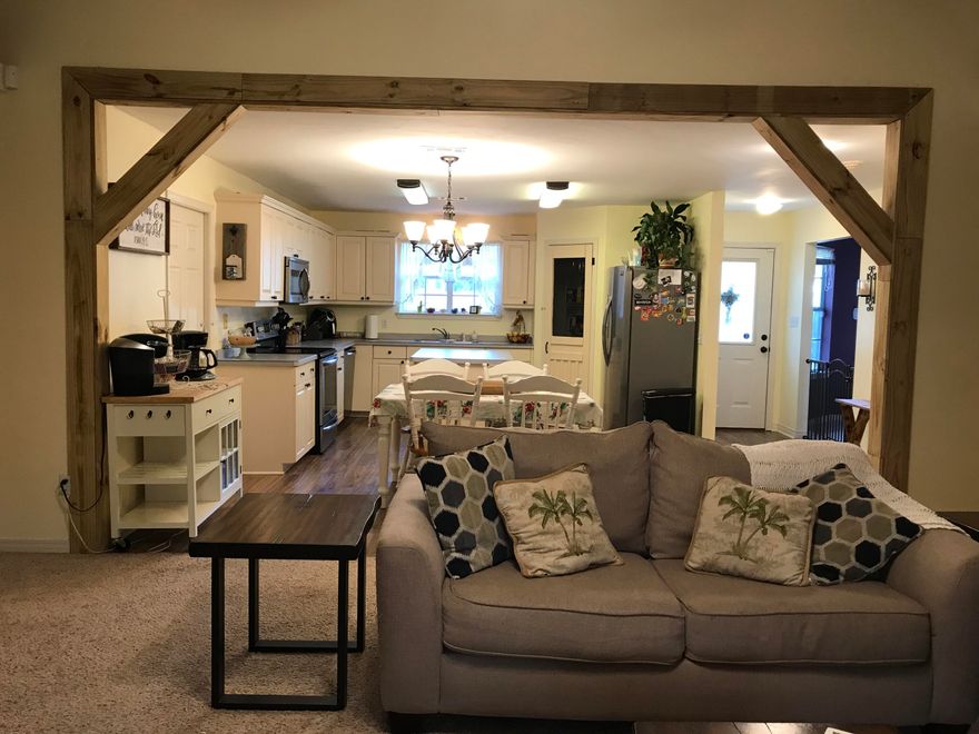 Beautifully Decorated-glorious 3 BDR 2 BTH Navarre Home-No HOA!!!- 2nd owner-welcoming location-easy access to golf course & Beach-Boasting a completely fenced Spacious backyard full of Mature Fruit Trees,w/screened back patio- Split Open Floor Plan-Open Kitchen/Dining to LvRoom w/Plank Wall & Banisters-Cathedral Ceilings- Kitchen w/island-New 2017 SS Appliances-New 2018 HVAC system-Termite Bond w/Home!-Septic pumped in Summer 2019-Roof replaced 2010-New fresh paint- Carpet like new 2016- Laminate/tile floors-Mstr BDR w/ double vanity & garden Tub- New Fixtures Throughout- Home Warranty offered w/acceptable Sale Price-many more features to see!!!!