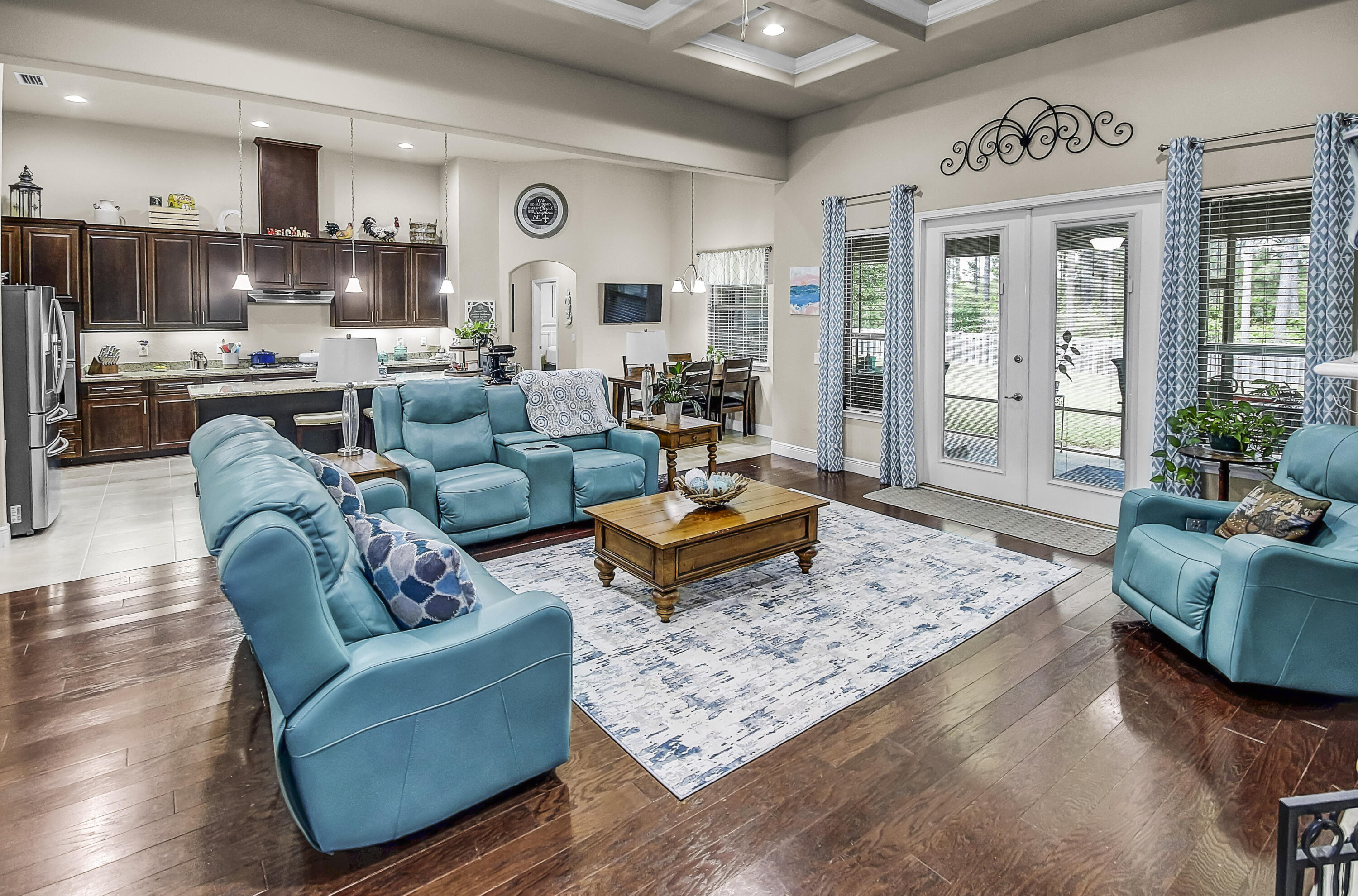 Enjoy an amazing lifestyle in Hammock Bay! This beauty w/screened lanai has incredible lake views!  A One-story w/ an exceptional floor plan that includes 4 bedrooms, 3 baths, office, dining rm, flex rm and a 2 car garage. Soaring 12 foot ceilings, coffered ceilings, hand scraped hardwood flooring and granite are just a few of the many upgrades. The fantastic kitchen features stainless appliances - 5 burner gas cooktop, dbl ovens, 42'' cabinetry, butlers pantry, large island w/seating area and a breakfast dining area overlooking the spacious backyard and lake. The impressive master bdr has its own sitting area and an exceptional bath w/2 separate vanities, garden tub w/tile surround and a large walk in custom tile shower. The 4th bdr has a private bath and is ideal for a M-I-Law or guest.