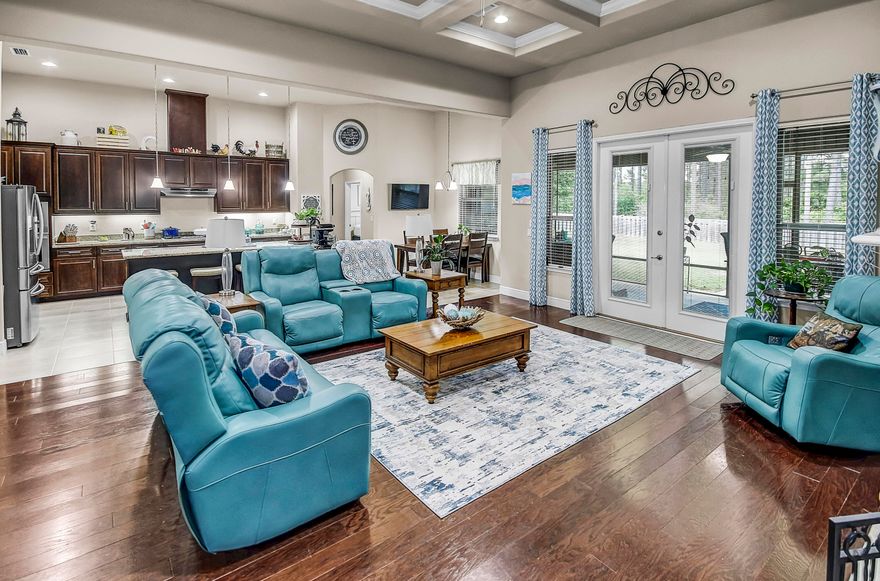 Enjoy an amazing lifestyle in Hammock Bay! This beauty w/screened lanai has incredible lake views!  A One-story w/ an exceptional floor plan that includes 4 bedrooms, 3 baths, office, dining rm, flex rm and a 2 car garage. Soaring 12 foot ceilings, coffered ceilings, hand scraped hardwood flooring and granite are just a few of the many upgrades. The fantastic kitchen features stainless appliances - 5 burner gas cooktop, dbl ovens, 42'' cabinetry, butlers pantry, large island w/seating area and a breakfast dining area overlooking the spacious backyard and lake. The impressive master bdr has its own sitting area and an exceptional bath w/2 separate vanities, garden tub w/tile surround and a large walk in custom tile shower. The 4th bdr has a private bath and is ideal for a M-I-Law or guest.