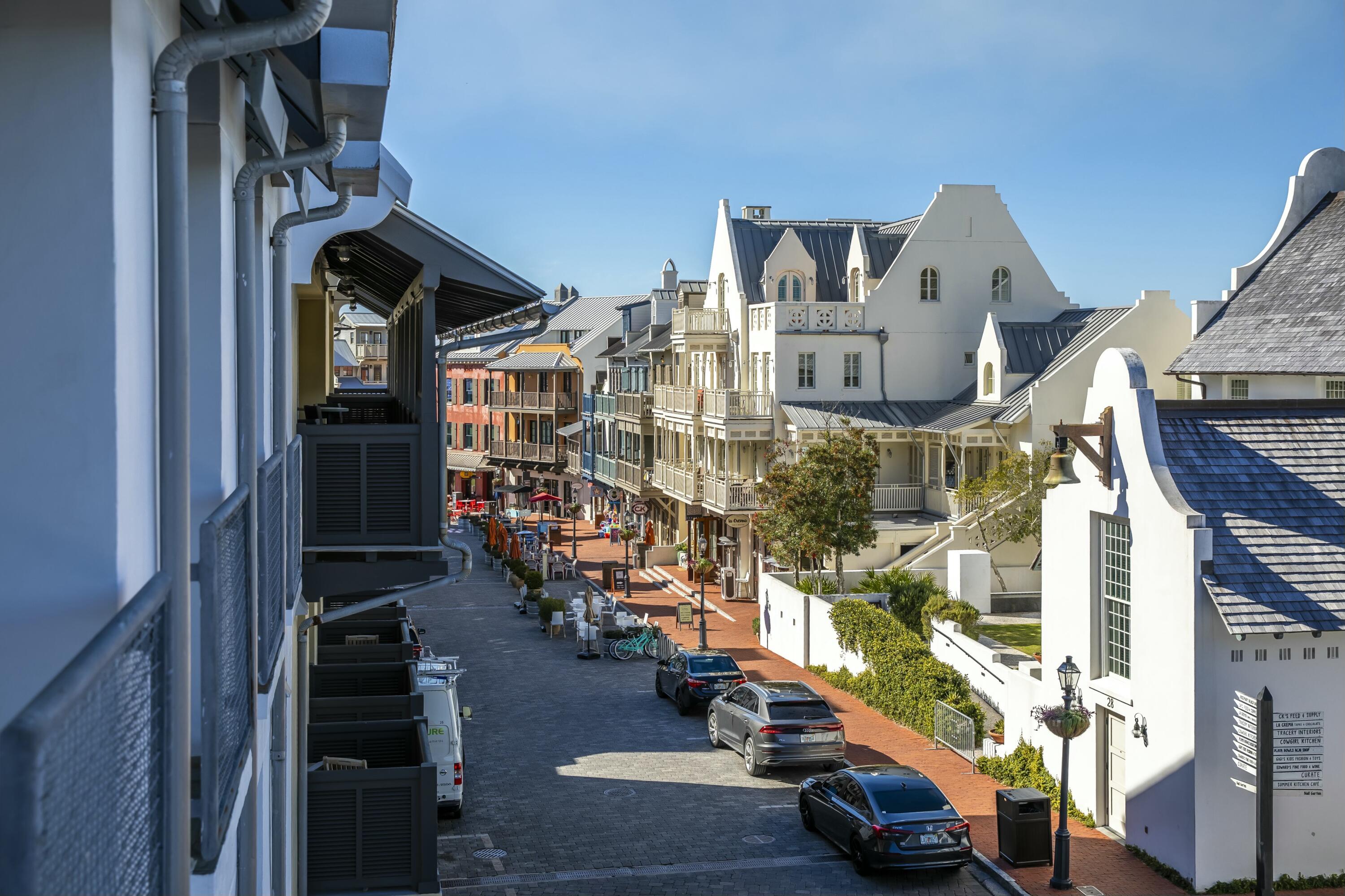 Best views of Main Street on the Gulf Side in Rosemary Beach! This corner, 3rd Floor condo with LIGHT, LIGHT WHERE CITY MEETS THE BEACH! This unit has not been rented, in impeccable condition and being offered fully furnished! One of the most unique and functional floor plans, this unit offers an oval shaped Living Room flowing east to the Master Bedroom wing and southwest to the Kitchen/Dining/Keeping room. The Keeping room is a smaller sitting area located near the kitchen where one may keep the cook company or perfect for morning cartoons. Adjacent is the wet bar offering a nugget ice machine, refrigeration drawers, extra storage and beautiful glass shelving. The Guest Bedroom with en suite Bath also occupies this wing in a split floor plan. There are custom bunk beds across from the half bath making this the perfect layout and room for everyone to have their own space. Five separate balconies wrap the outer perimeter of the Condo such that every room enjoys a view of Barrett Square. This Rosemary Beach Town Center location is especially wonderful when events are hosted allowing a front row seat to all that is happening. The views down Main Street make this property one of the most charming in Rosemary Beach! There are two dedicated parking spots deeded to this unit.