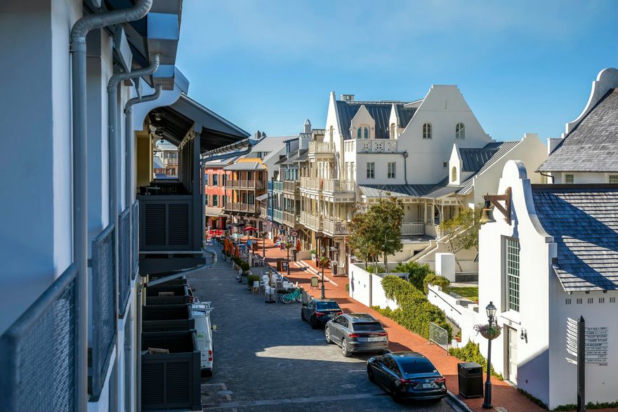 Best views of Main Street on the Gulf Side in Rosemary Beach! This corner, 3rd Floor condo with LIGHT, LIGHT WHERE CITY MEETS THE BEACH! This unit has not been rented, in impeccable condition and being offered fully furnished! One of the most unique and functional floor plans, this unit offers an oval shaped Living Room flowing east to the Master Bedroom wing and southwest to the Kitchen/Dining/Keeping room. The Keeping room is a smaller sitting area located near the kitchen where one may keep the cook company or perfect for morning cartoons. Adjacent is the wet bar offering a nugget ice machine, refrigeration drawers, extra storage and beautiful glass shelving. The Guest Bedroom with en suite Bath also occupies this wing in a split floor plan. There are custom bunk beds across from the half bath making this the perfect layout and room for everyone to have their own space. Five separate balconies wrap the outer perimeter of the Condo such that every room enjoys a view of Barrett Square. This Rosemary Beach Town Center location is especially wonderful when events are hosted allowing a front row seat to all that is happening. The views down Main Street make this property one of the most charming in Rosemary Beach! There are two dedicated parking spots deeded to this unit. 