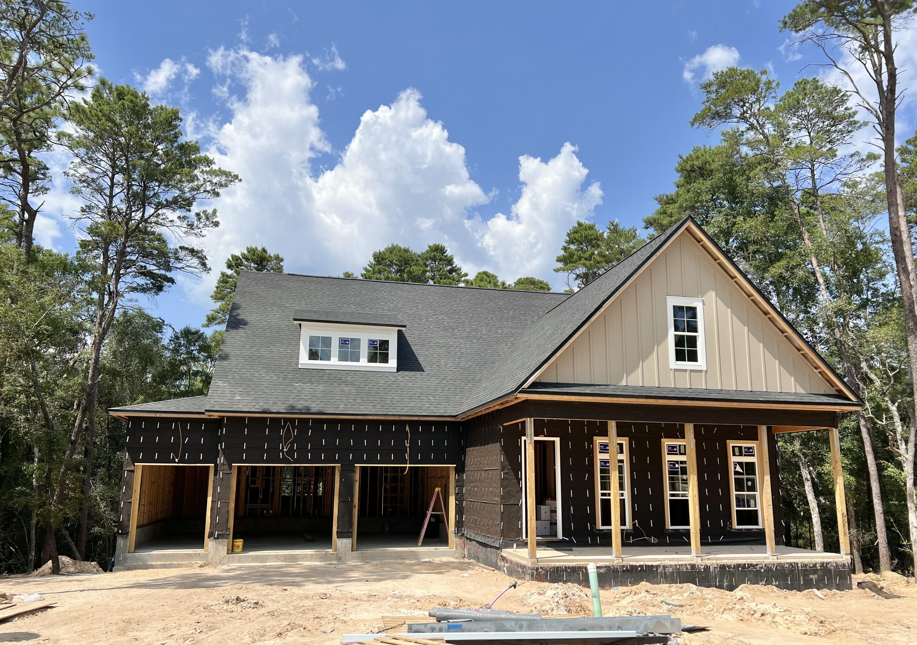 Estimated completion Feb/March 2026! The Anna Basement Plan - Loaded with Upgrades and Showcasing a Breathtaking View! A charming, large front porch sets the tone as you enter this thoughtfully designed home. The open-concept kitchen features ample cabinetry, a large pantry, a beautiful center island, and flows seamlessly into a spacious living area that captures gorgeous nature views. The main floor features the primary suite with stunning view of the woods, along with two walk-in closets and a luxurious en-suite bathroom. An additional bedroom with a full bath on the main level provides flexibility for guests or family. Step out onto the covered back porch, the perfect spot to relax and unwind while enjoying the peaceful surroundings. The home also includes a 3-car front-load garage providing both convenience and curb appeal. Downstairs, the finished basement expands your living space with two additional bedrooms, each with its own full bathroom and walk-in closet. A private study, cozy parlor, and an expansive recreational/family room offer endless possibilities for work, play, or entertainment. A covered back patio completes the lower level, ideal for hosting or simply enjoying the outdoors.