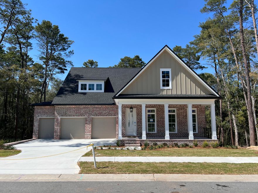 Estimated completion March/April 2026! The Anna Basement Plan - Loaded with Upgrades and Showcasing a Breathtaking View! A charming, large front porch sets the tone as you enter this thoughtfully designed home. The open-concept kitchen features ample cabinetry, a large pantry, a beautiful center island, and flows seamlessly into a spacious living area that captures gorgeous nature views. The main floor features the primary suite with stunning view of the woods, along with two walk-in closets and a luxurious en-suite bathroom. An additional bedroom with a full bath on the main level provides flexibility for guests or family. Step out onto the covered back porch, the perfect spot to relax and unwind while enjoying the peaceful surroundings. The home also includes a 3-car front-load garage providing both convenience and curb appeal. Downstairs, the finished basement expands your living space with two additional bedrooms, each with its own full bathroom and walk-in closet. A private study, cozy parlor, and an expansive recreational/family room offer endless possibilities for work, play, or entertainment. A covered back patio completes the lower level, ideal for hosting or simply enjoying the outdoors.