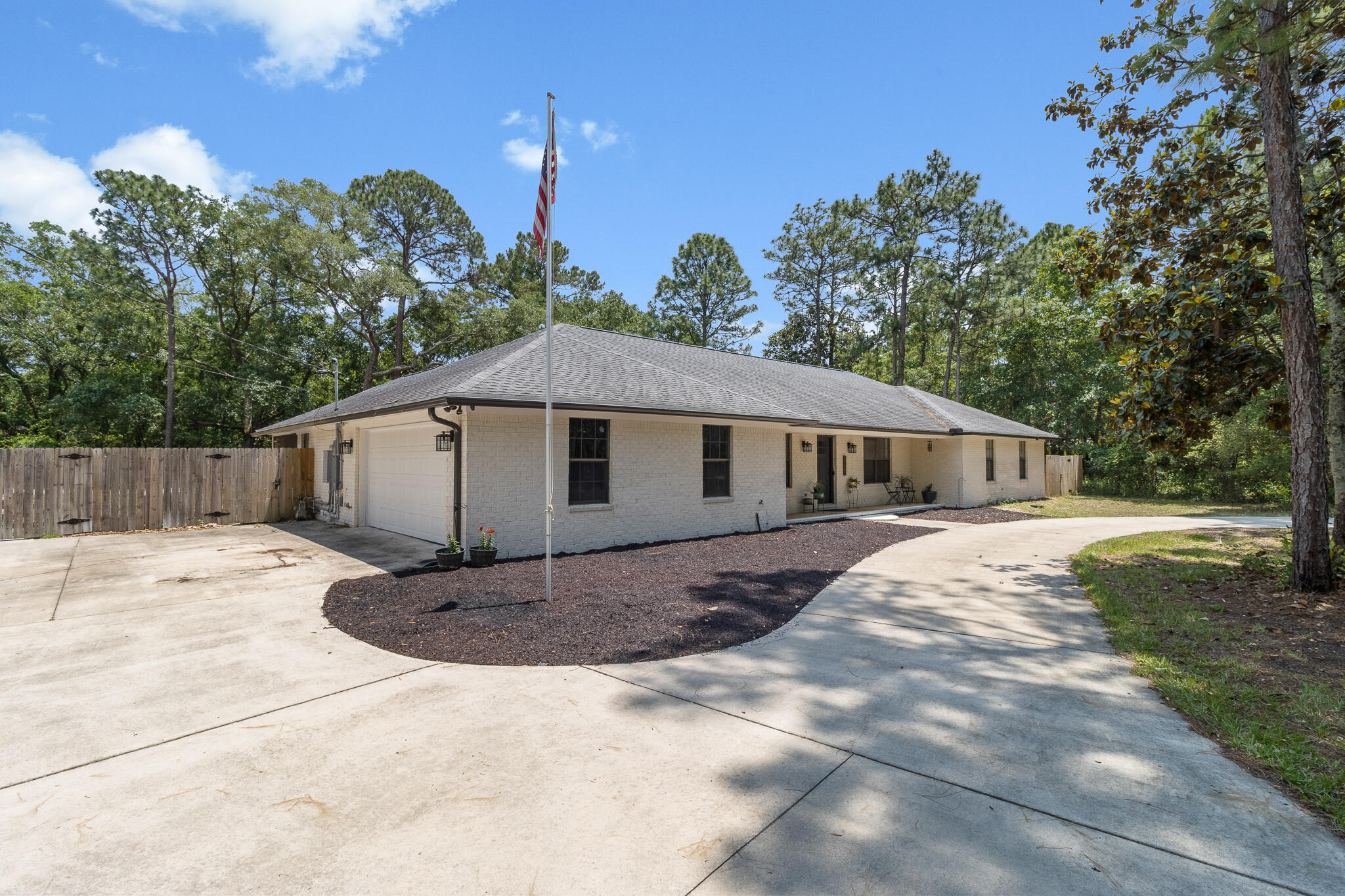 A rare find! This completely renovated, no HOA, 4 bedroom, 3 bath, brick home sits on a 3/4 acre lot, providing the luxury of multiple boat/RV parking, room for a pool, room to play, room to garden, a fire-pit, a screened porch and more! The circular driveway has room for up to 12 cars plus an oversized 2-car garage. AND,a park and boat launch are minutes away!  Endless updates and improvements greet you inside, giving this traditional home a modern feel. New flooring and a fireplace make for a cozy living space, while the eat-in kitchen flows back and forth to the kitchen and family room. The kitchen features new lighting, new backsplash, a gas stove, and stainless steel appliances.  The main bedroom & bath, 2 bedrooms, and 2nd bath are off the living area,