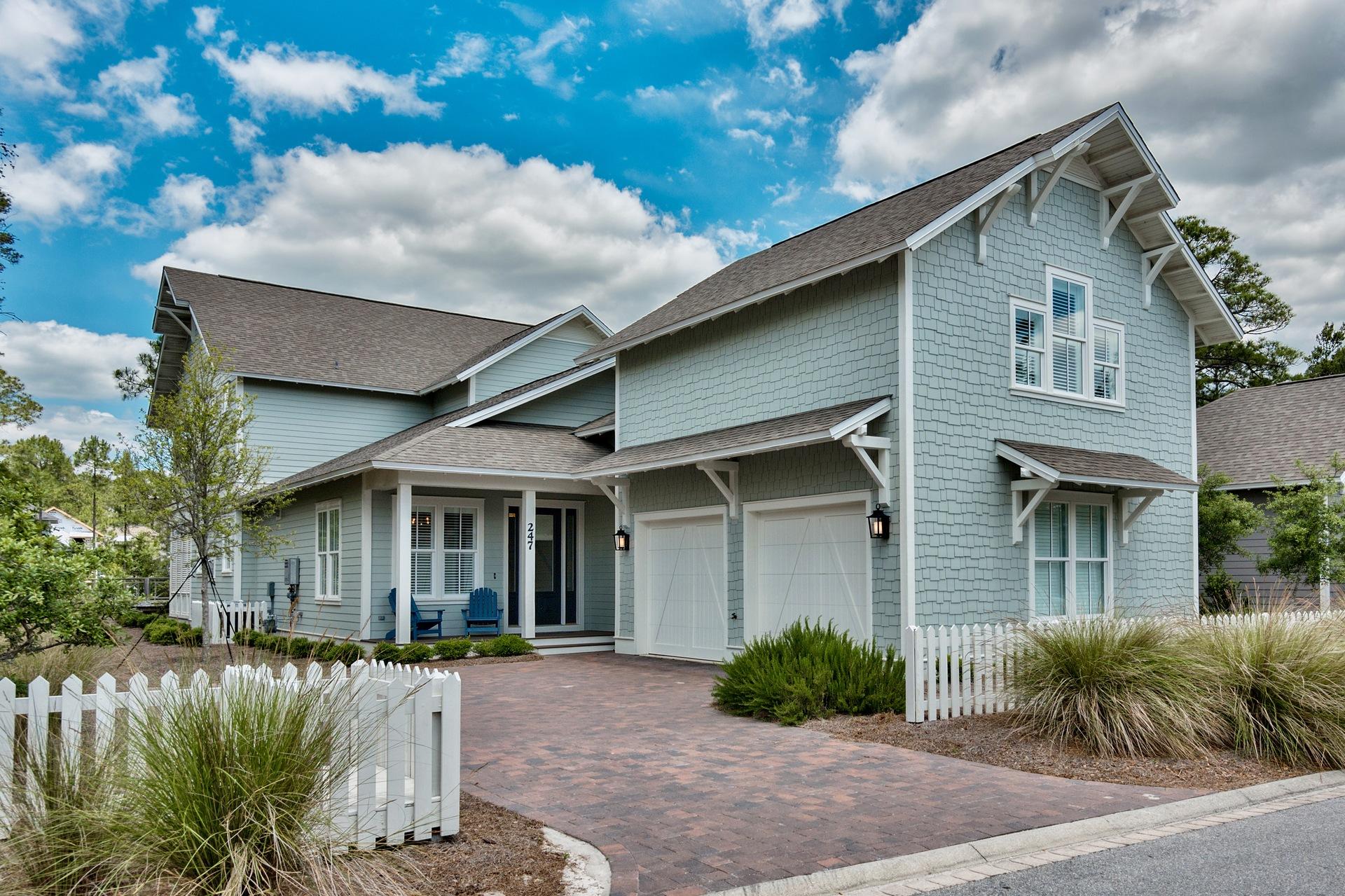 Welcome to your perfect 30a beach home! Located in the private gated community of Watersound West Beach, you will enjoy beach access to one of 30a's premier secluded beaches through Deer Lake State Park. This beautiful home features 2 HUGE porches overlooking the lake surrounded by bridges and boardwalks. The layout of this home is perfect for visits from family and friends--spacious master suite on the first floor and 2 bedrooms with baths plus a den with daybed on the second floor. There is also a carriageover the garage with bath, closet, kitchenette, andlarge storage area. The great room is open to the well appointed kitchen and features a gas fireplace and french doors to the screened porch with summer kitchen and TV overlooking the lake. A gorgeous master suite also boasts french doors to the porch and highlights include extensive trim work, garden tub, large walk-in shower with dual showers heads, and 2 custom walk-in closets. This lovely beach retreat features hardwood floors throughout, crown moulding, granite and marble counters, custom plantation shutters, whole house dehumidifier, and much more. A beautiful dining room, large laundry, powder room, and 2-car garage with car lift complete this lovely home. Watersound West Beach features a
community pool, two parks, numerous boardwalks, private access to the beach, and membership to the Watersound Fitness Center. Enjoy the beach life!!!