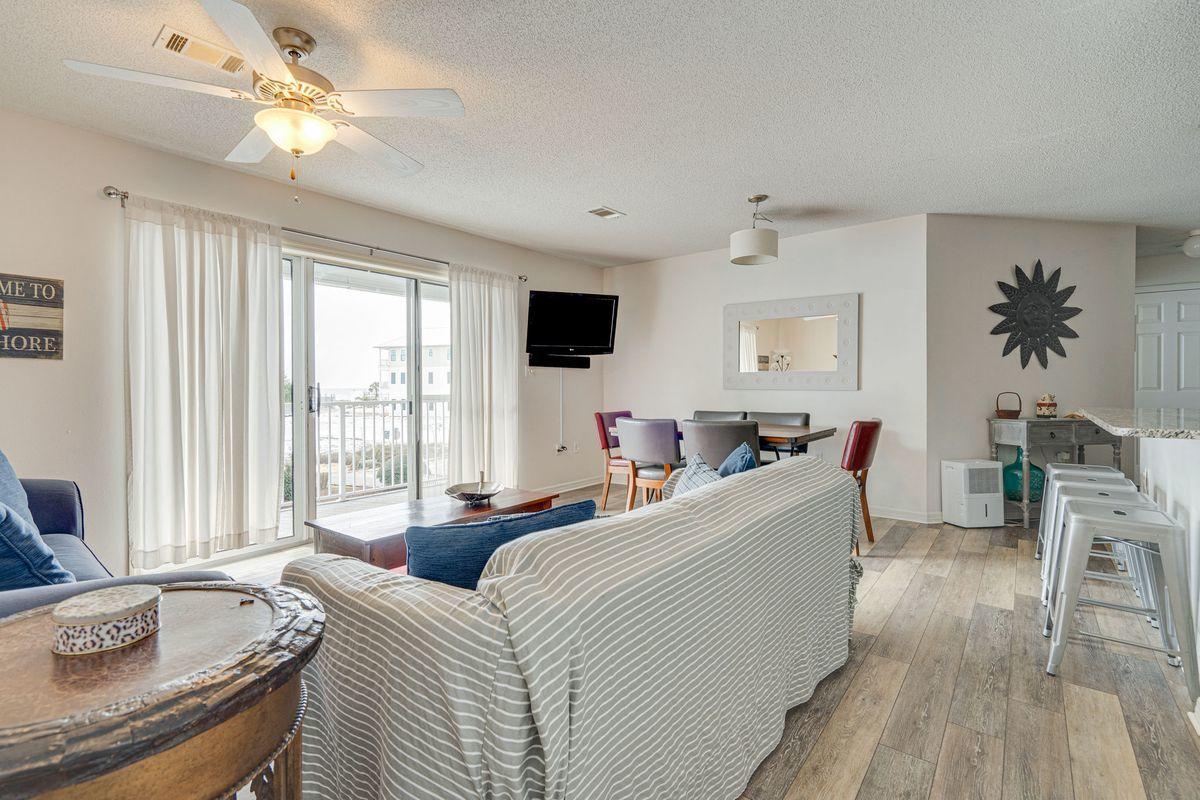 Ideally located South of 30A between a coastal dune lake and the Gulf of Mexico, Beachside Villas has everything you need right where you want to be. Unit #222 is perfectly situated on the west end of desirable Building 2, offering a scenic Gulf view. Inside, recent upgrades include new luxury vinyl plank flooring throughout, fresh interior paint, new LG stainless steel appliances, and new bathroom vanities. The private balcony which runs the length of the condo unit and offers Gulf views is accessible from the living dining area and the master suite. Two additional bedrooms and a jack-and-jill bath offer plenty of space for families. Community amenities include a swimming pool, tennis courts, a shuffleboard court, and easy access to the pearl white sand beaches just steps from your door.