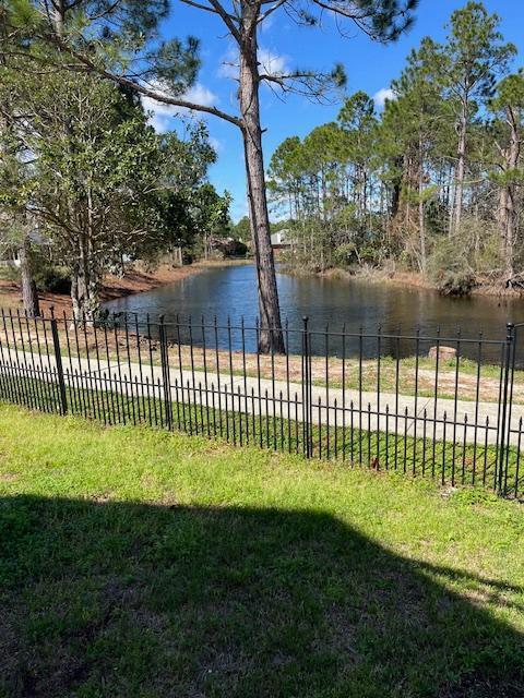 4 bedroom and 2 full bathroom brick home in a gated community in Navarre. New HVAC installed in 2022 and new roof in 2019. Home features a fireplace in the great room area. The kitchen has all stainless steel appliances, cherry wood cabinets, deep sinks with new faucet.Hardwood floors in the living area and carpet in the bedrooms. Nice sized patio just off the living area and overlooking the lake. It is a nice area to reflect and watch the birds and ducks. There is a walking trail and a gazebo, community pool with seating area. BBQ Pit/grill;, dock; fishing,, pavilion/gazebo, and picnic area.