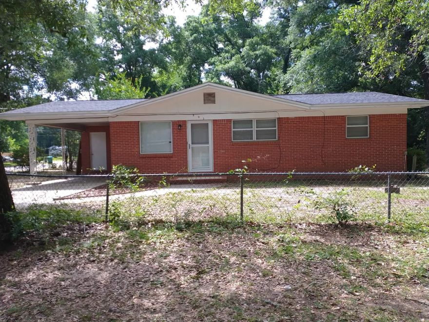 Charming home, centrally located just off downtown Crestview.  Easy access to shopping, beaches and military bases.  The roof was replaced in 2017, a/c unit and appliances replaced in 2021.  3 bedroom 1 bath brick home sits on two (2) lots.  Will make a nice home with a little TLC, or a great investment.  The Price Is Right!!!   Don't let this opportunity get away!!!