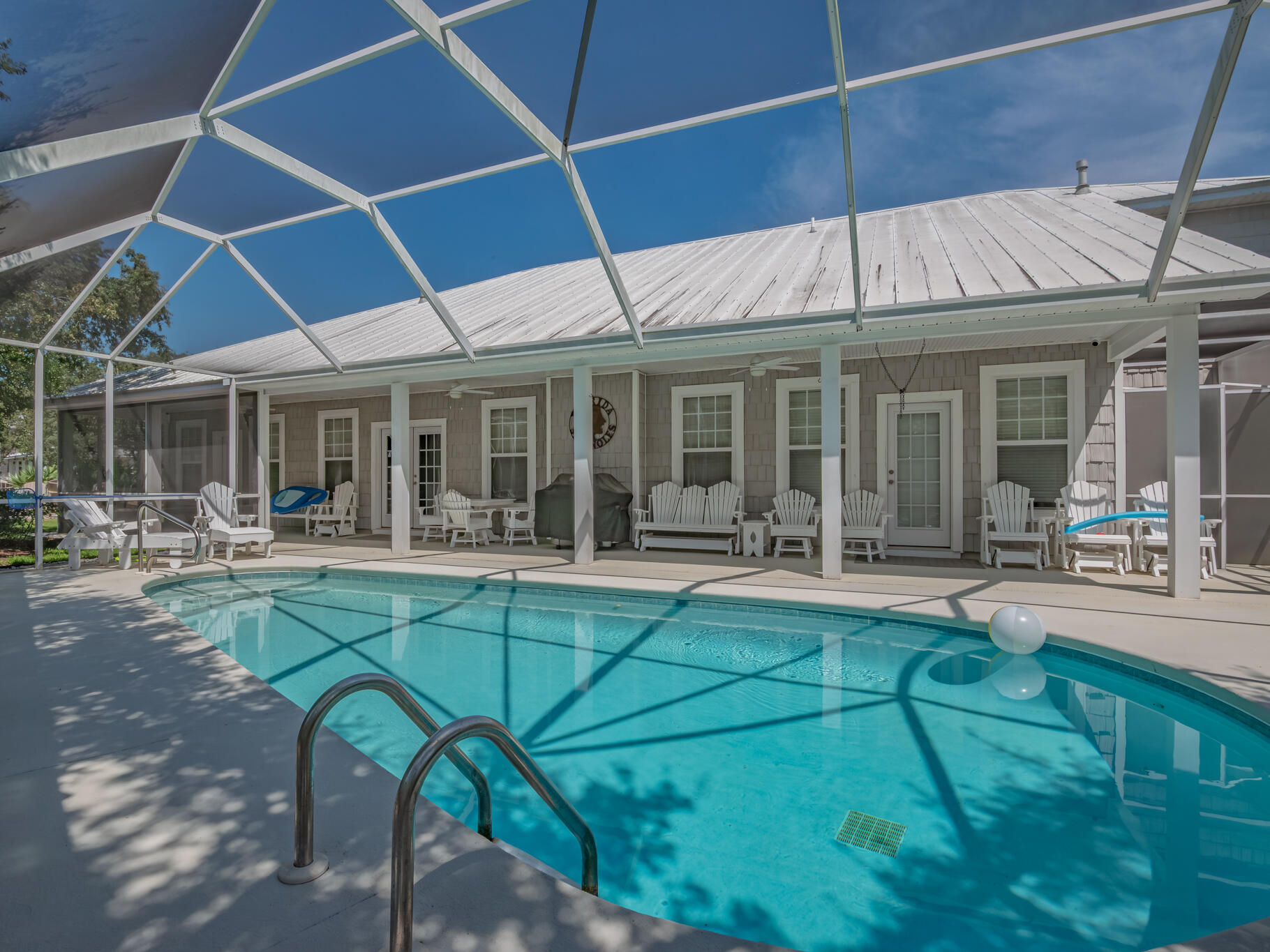 This beautifully renovated one-level beach retreat sits just off Scenic Highway 30A. Fully updated in 2019, Truly a property that must be seen to be appreciated. Featuring 3 spacious bedrooms, 2.5 baths, plus a versatile room that can serve as a 4th bedroom or office, this home also includes a climate-controlled flex space off the garage, perfect for a gym, or additional living area. Set on nearly 1/2 an acre, the private fenced backyard is designed for relaxation and entertaining, complete with a fire pit, heated screened-in saltwater pool, and outdoor shower. Two nearby beach access points (including a private deeded access), you're just steps from the sugar-white sands of 30A. EXTRAS: 3-car garage, Whole house generator, Walkable location to shops, dining, Alys, and Rosemary Beach.