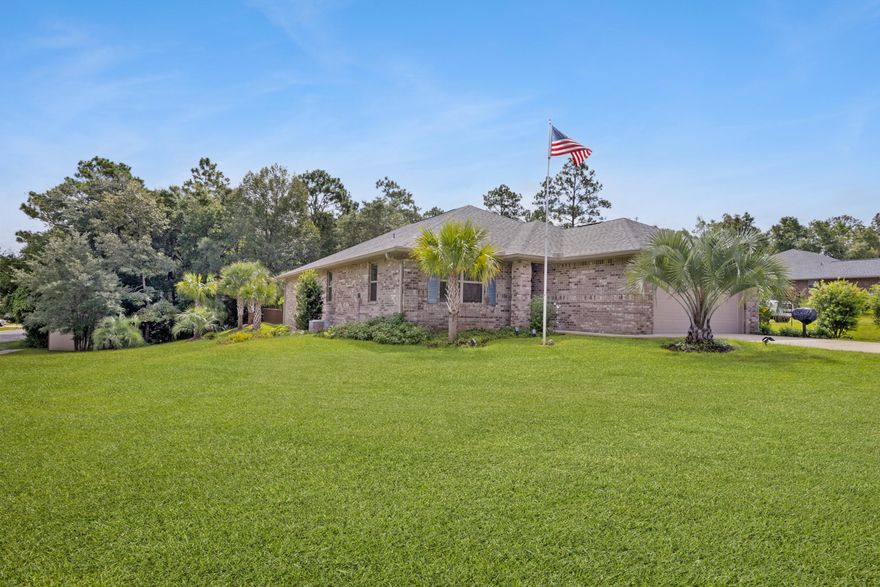 You must see this exquisite home. This home is situated on almost a half-acre, corner lot and on a cul-de-sac, this is a premium lot to say the least. When you pull up to the home you will appreciate the beautiful landscaping, and all the palm trees, they are gorgeous. This homeowner put pride into making this yard perfect. The home features an irrigation system so you will continue to have a beautiful lawn. The garage is finished with epoxy coated floors. When you enter through the front door you will be amazed, this home is just breath-taking. The floors have all been replaced with luxury vinyl planks throughout and carpet in the two guest rooms. Every inch of this home has been touched with elegance. The master bath features a huge walk-in closet and a brand-new ceramic walk-in shower
