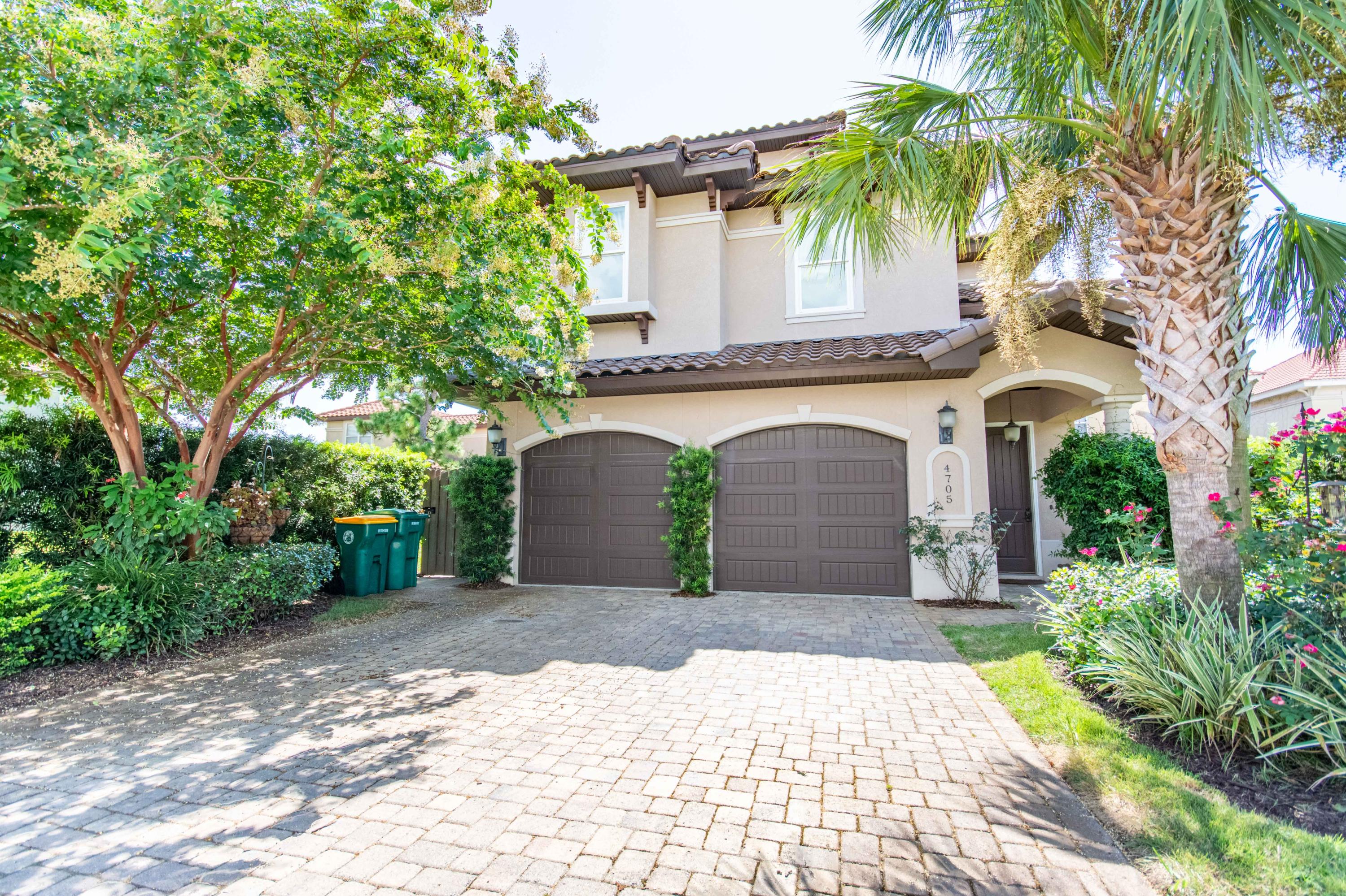 Live in the heart of Destin in this gorgeous custom-built home in Beautiful Calusa Bay. Built by the owner with meticulous detail to construction, finishes, and even maintenance this 3 story home is one of the few 4 bedrooms homes in Calusa Bay with 4 bathrooms, a large 2 Car Garage, open floor plan, and this much attention to detail. You'll find tall 10' Ceilings throughout except for 9' Ceilings on the 3rd story. Crown molding, Travertine Floors on the first level with Acacia wood risers on both staircases, office and 2nd level hallway. Walk-in Laundry with built in Cabinets, Custom Master Suite Closest and Bathroom with Jacuzzi Master Tub, Large Walk-in shower with 2 shower heads. Built in Office desks and cabinets in 3rd bedroom wired for surround sound. Second Master Suite on 3rd