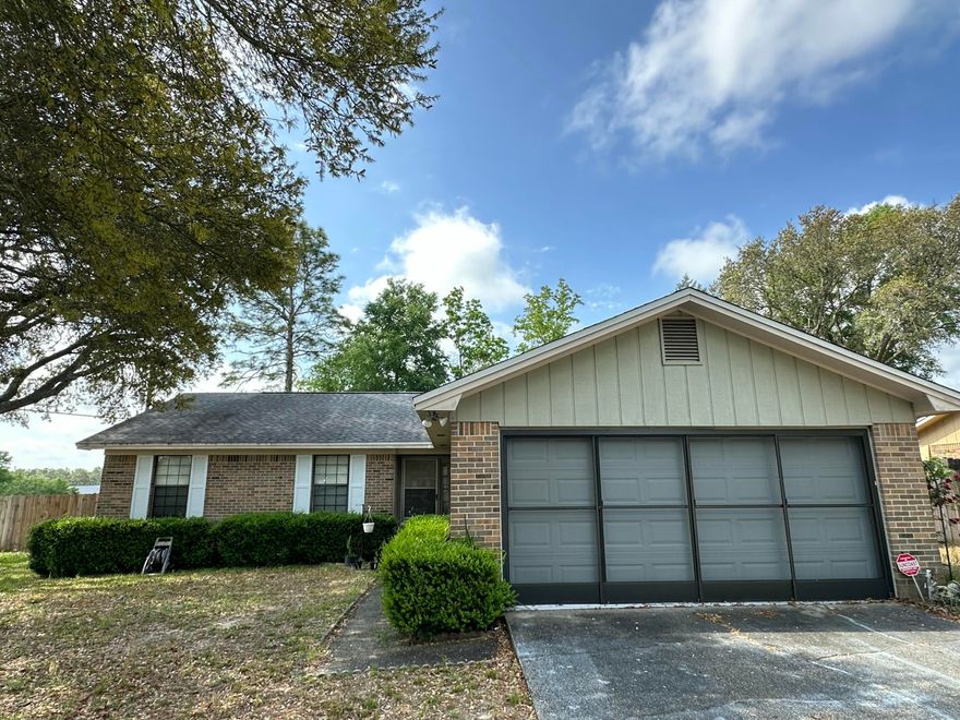 Step into a home where comfort and care shine through! This charming Crestview residence offers a spacious great room, perfect for gatherings and relaxation. Enjoy the warmth of the fireplace, the airy feel of the vaulted ceiling, and the convenience of two ceiling fans. The great room seamlessly extends to a delightful 10x16 screened porch, ideal for enjoying the Florida breeze. The kitchen boasts European-style cabinets and a pantry, providing ample storage. Privacy is yours in the fenced backyard with mature Rhododenrons . Additional features include a two-car garage with a sliding screen door, and skylights that brighten both the hall and master bathrooms. This home is ready for you to make it your own!Please Note **Listing agent has ownership interest**