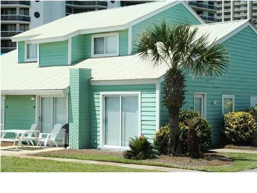 Truly a gem located on sparkling blue gulf waters with a gated private beach! This ''Cozy'' unit is the best in the whole development featuring unobstructed views of the Gulf from the living area and master bedroom! This beach townhome was professionally renovated to maximize its beautiful interior adorned with high end furniture and renovations that are incredible! New granite, tile, doors, molding, toilets, bathtub, custom shower accented with gorgeous glass tiles, built in closets, double vanity, flat screen televisions and so much more.  You'll be amazed at how spacious and comfortable this luxury unit feels. You won't find another unit like this one anywhere on the gulf. The double door sliders provide Gulf Front Views that are huge! It even has a front yard that is green and spacious