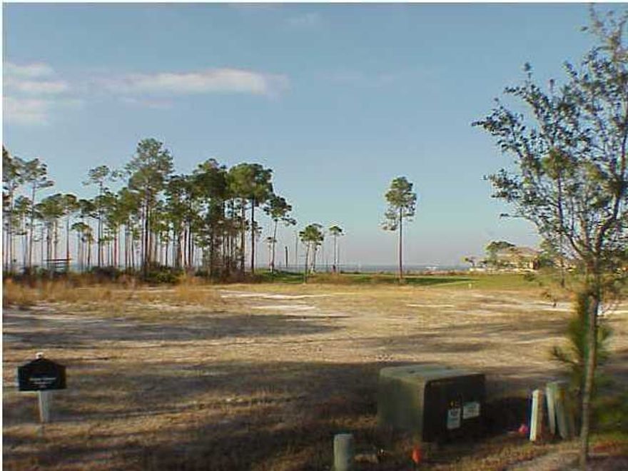 ONE OF THE LAST ESTATE SIZED LOTS LEFT WITH BAYVIEWS !!!3256 Burnt Pine Cove is a large very private estate sized homesite located in a cul de sac with spectacular bay and golf course views in the gated community of BURNT PINE. Burnt Pine Cove is one of the most exclusive streets in the neighborhood and the vacant homesite is surrounded by multi million dollar custom homes. Part owner is a Licensed Real Estate Agent Listing Broker/Salesperson has ownership interest in the property.