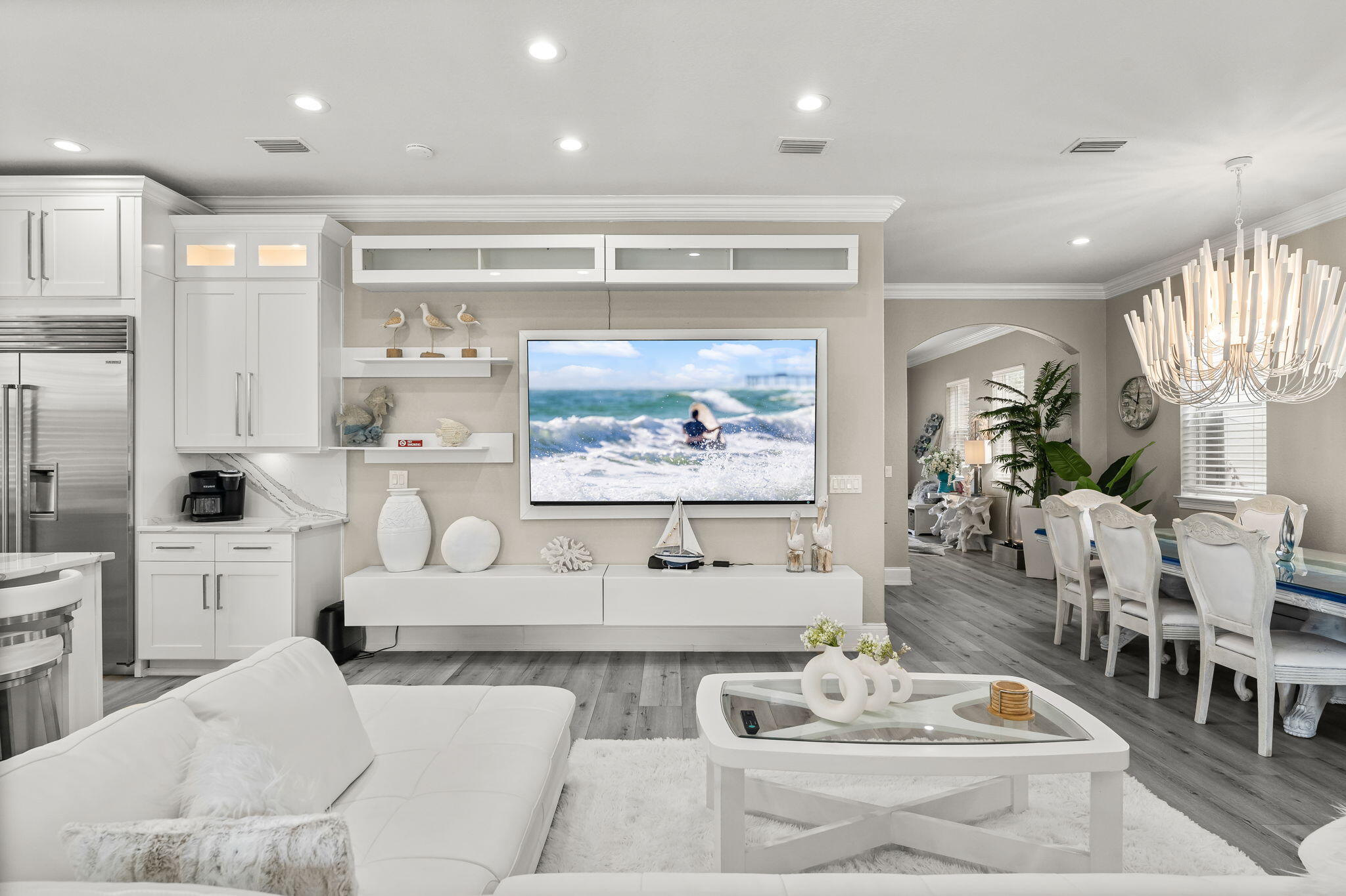 Indulge in unparalleled beachside elegance with this meticulously remodeled 3-story estate. Perfectly suited as an extraordinary rental or a lavish primary residence, this expansive 4,820 sq. ft. home offers 6 bedrooms, 5 baths, and ample space to accommodate 33 guests in absolute comfort.Upon entering, you're greeted by an open, airy main floor designed for seamless entertaining. There is a guest bedroom on the main floor. The spacious living area flows effortlessly into the chef-inspired kitchen, featuring top-of-the-line Wolf and Sub Zero appliances and sleek quartz countertops -- a dream for culinary enthusiasts. The adjacent patio extends the living space, ideal for al fresco dining or relaxing with loved ones. Relax by the private heated pool and spa after a day at the beach and play ball with the kids in the Astroturf backyard. The pool shower/changing room is unlike any other making a great space to clean off the sand before jumping in the pool! Every floor of this home has a balcony where you can enjoy the breathtaking Florida sunsets. Highest elevation in the area sitting approximately 15 feet higher than the surrounding homes. No flood zone and No HOA!
An elevator allows for easy access to the 2nd and 3rd floors where you will find the spacious guest rooms plus a flex space/media or game room. The master bedroom with gulf views features a sitting area, wet bar, large walk-in closet, and even a secondary laundry room!
Recent upgrades include three new HVAC , one on each floor, pool resurfaced and tiled as well as new travertine tile pool deck, a unique 2 story bunk room with 7 bunks, sleeping 13 guests, and an Astroturf backyard for easy maintenance along with a 5 foot retaining wall. This home is a must see to appreciate the gorgeous finishes of this 2022-2023 top of the line renovation. Easy walk or golf cart ride to the private beach access! This luxury estate is located near the fun of Baytowne Wharf, Grand Boulevard, Destin Commons, fabulous restaurants and all that the stunning Emerald Coast has to offer. Golf Cart is included with an acceptable offer!