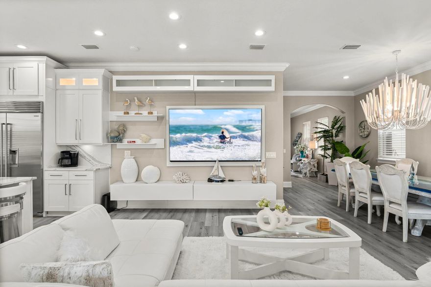 Indulge in unparalleled beachside elegance with this meticulously remodeled 3-story estate. Perfectly suited as an extraordinary rental or a lavish primary residence, this expansive 4,820 sq. ft. home offers 6 bedrooms, 5 baths, and ample space to accommodate 33 guests in absolute comfort.Upon entering, you're greeted by an open, airy main floor designed for seamless entertaining. There is a guest bedroom on the main floor.  The spacious living area flows effortlessly into the chef-inspired kitchen, featuring top-of-the-line Wolf and Sub Zero appliances and sleek quartz countertops -- a dream for culinary enthusiasts. The adjacent patio extends the living space, ideal for al fresco dining or relaxing with loved ones. Relax by the private heated pool and spa after a day at the beach and play ball with the kids in the Astroturf backyard. The pool shower/changing room is unlike any other making a great space to clean off the sand before jumping in the pool! Every floor of this home has a balcony where you can enjoy the breathtaking Florida sunsets. Highest elevation in the area sitting approximately 15 feet higher than the surrounding homes. No flood zone and No HOA! 

An elevator allows for easy access to the 2nd and 3rd floors where you will find the spacious guest rooms plus a flex space/media or game room. The master bedroom with gulf views features a sitting area, wet bar, large walk-in closet, and even a secondary laundry room!

Recent upgrades include three new HVAC , one on each floor, pool resurfaced and tiled as well as new travertine tile pool deck, a unique 2 story bunk room with 7 bunks, sleeping 13 guests, and an Astroturf backyard for easy maintenance along with a 5 foot retaining wall. This home is a must see to appreciate the gorgeous finishes of this 2022-2023 top of the line renovation. Easy walk or golf cart ride to the private beach access! This luxury estate is located near the fun of Baytowne Wharf, Grand Boulevard, Destin Commons, fabulous restaurants and all that the stunning Emerald Coast has to offer.  Golf Cart is included with an acceptable offer!