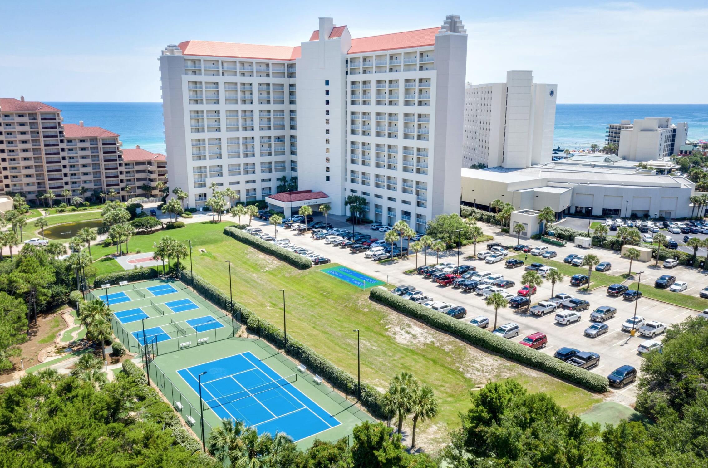 This charming second-floor unit at Tides at Tops'l consists of two bedrooms, two bathrooms, a spacious balcony, and large glass sliders allowing for plentiful natural light and views of the beautiful Gulf waters. The kitchen features stainless steel appliances, granite countertops, and dark cabinetry. The master suite and guest room are cozy and tastefully decorated with coastal decor. The master bath is large and features a new walk-in tiled shower with glass doors and bench seating. Two owner's closets are great for use when the unit is utilized as a vacation rental property. Recent updates include a new refrigerator, new water heater, and new vanity lights. This well-maintained unit makes for a fantastic income-producing property or second home! Located in the desirable gated community of TOPS'L Resort featuring 52 acres of resort-style living, this gated community offers an impeccable private beachside resort experience. Tides at TOPS'l owners enjoy an exclusive Gulf-front pool, tennis courts, pickleball courts, shuffleboard, a grilling area, poolside bar and grill, tram service throughout the resort, and 600 feet of pristine private beaches along the stunning shores that are part of the Emerald Coast! Additionally, TOPS'L owners have the option to join the award-winning tennis and fitness center on the resort with club membership to world class tennis, 12 lighted courts, pro-shop, fitness facility, exercise classes, saunas, locker rooms, racquetball court, indoor and outdoor club pool, the Topspin Club Bistro, and other amenities include mini golf, basketball, gas grills, and meeting/conference rooms.