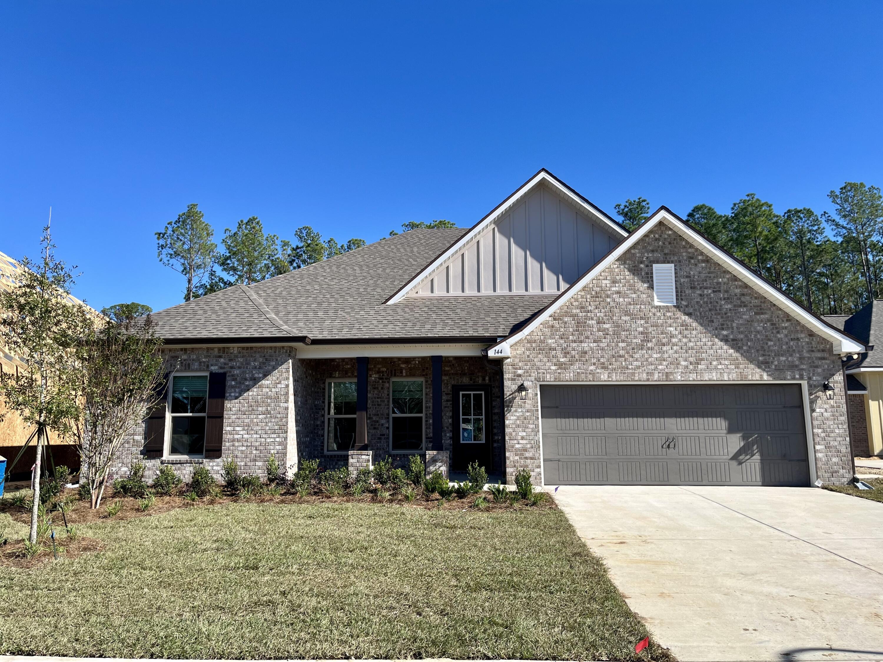 The COMSTOCK III H in Starburst at Hammock Bay community offers a 4 bedroom, 2 full bathroom, open and split design. Upgrades added (list attached).  Features: double vanity, garden tub, separate custom tiled shower, and walk-in closet in master bath, kitchen island, walk-in pantry, boot bench in mudroom, covered front porch and rear patio, crown molding, recessed lighting, framed mirrors in baths, smart connect WIFI thermostat, smoke and carbon monoxide detectors, landscaping package, architectural 30-year shingles, flood lights, and more!Energy Efficient Features: water heater, kitchen appliance package with electric range, vinyl low E windows, and more! Energy Star Partner.