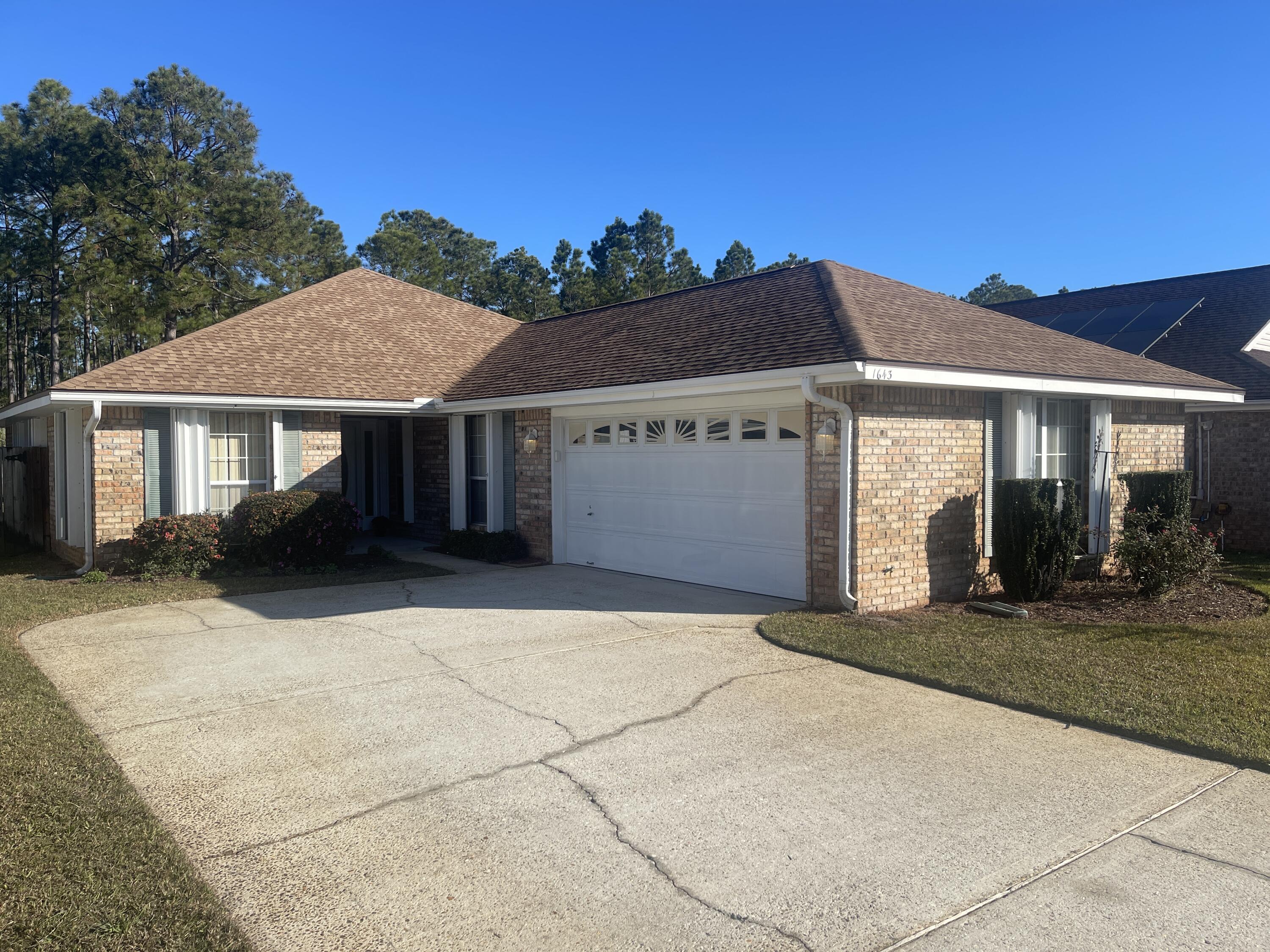 Conveniently located about a mile from the Hurlburt Field back gate is this well-maintained 3 BR, 2 FB home in Emerald Village. Just under a quarter acre lot; fully fenced back yard. Screened in back patio for enjoying the peaceful yard which backs to woods. The patio has new outdoor ceiling fans with light fixtures. The exterior windows and doors have hurricane shutters for extra protection during hurricane season.Perfect for low maintenance, this all brick home has vinyl plank flooring in the main living area and tile in the kitchen. The bedrooms have brand new carpet! Never been lived on :) You'll love the convenient location with easy access to the Destin/FWB Airport and Hurlburt Field, Ft. Walton Beach, Destin, and of course, the BEACH!