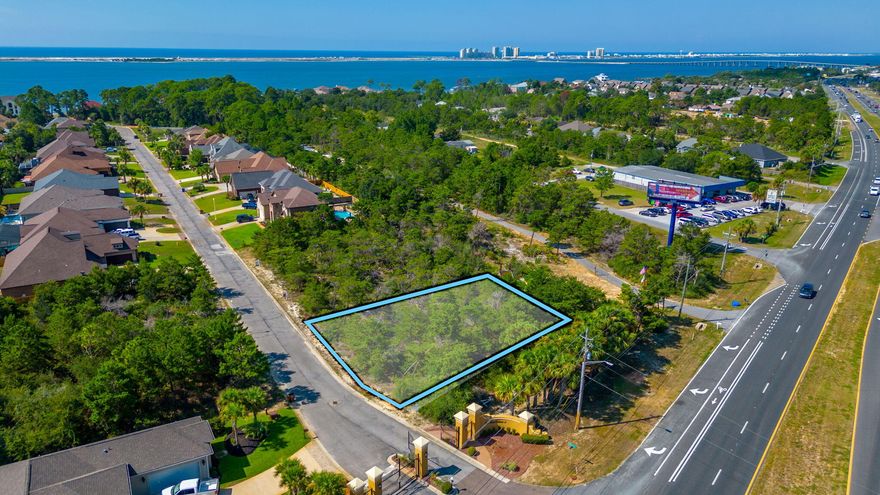 Come build your dream home on this wooded lot in the gated community of La Fontaine, where location is EVERYTHING. Fontainebleau Court is
minutes away from ''Florida's Best Kept Secret'', Navarre Beach; 22 miles from Destin and 27 miles from Pensacola. Lot is walking distance from your own
slice of paradise where the community of La Fontaine holds deeded access to the Santa Rosa Sound- Launch your kayak, paddle board, or maybe catch sight of
a pod of dolphins while relaxing at the community gazebo. Lot has plumbing, sewer, and underground electric; utility tap fees may apply.  Call your favorite REALTOR to preview this gated community.