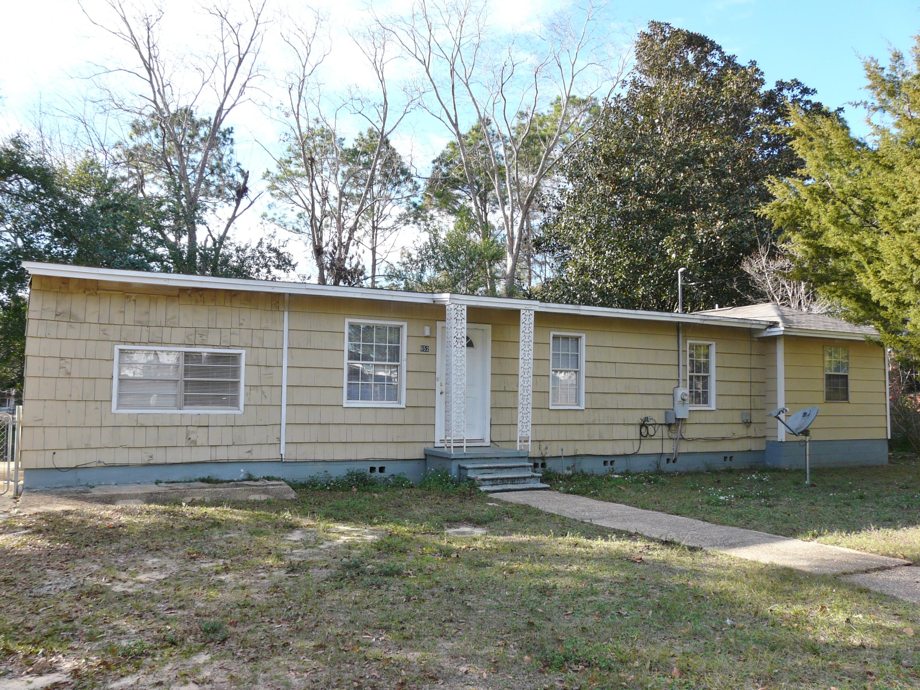 Great deal on 4 bedroom/2 bath home under 60k! Centrally located in Crestview, this home is move-in ready! 2 large living areas! Additional bonus room with exterior access, can be used as office/play area/or another living space! Seller has made updates in Bathroom, Kitchen, and additional Bedrooms. Great flat lot with fenced in backyard. Lots of shade with mature trees. You will have to see this one in person to truly appreciate it!