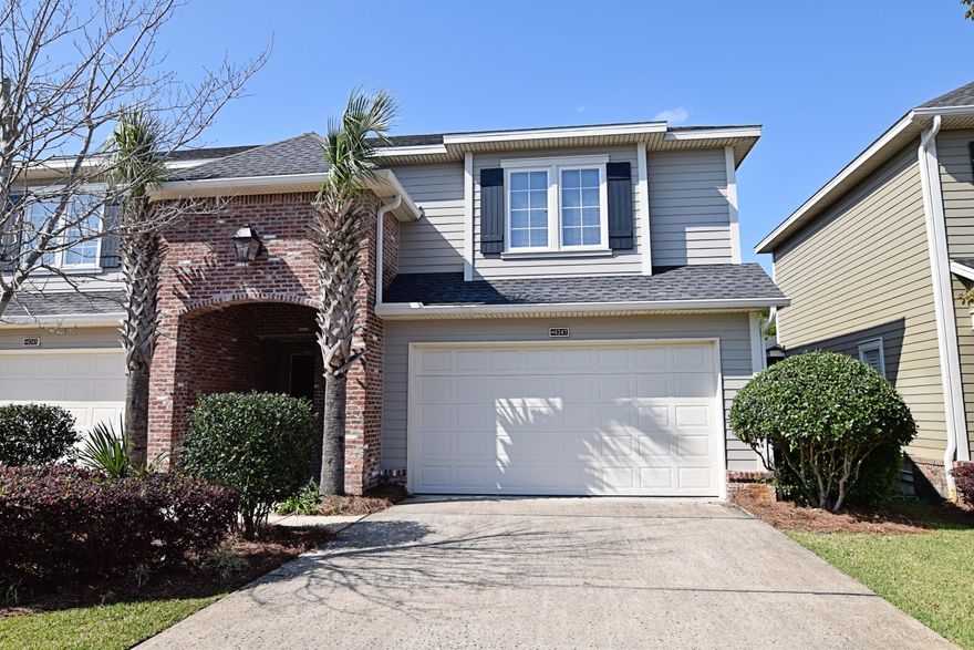 From the moment you approach this beautiful townhome the high quality of workmanship is apparent. From the elegant brick entryway to the stained glass front door, you will be proud to call this home. As you enter, the beautiful diagonal tile draws in you in to the open and roomy combined living and dining space. The gorgeous kitchen could be out of a magazine with the handsome dark cabinets offset by light granite countertops.You will enjoy relaxing on the screened sunroom off of the dining room and the fenced yard perfect for a pet. At the end of the day, you ascend the beautiful staircase to find the three nice sized bedrooms upstairs,complete with large bathrooms and plenty of closet space. This end unit is a great place to call home- come and see for yourself today!