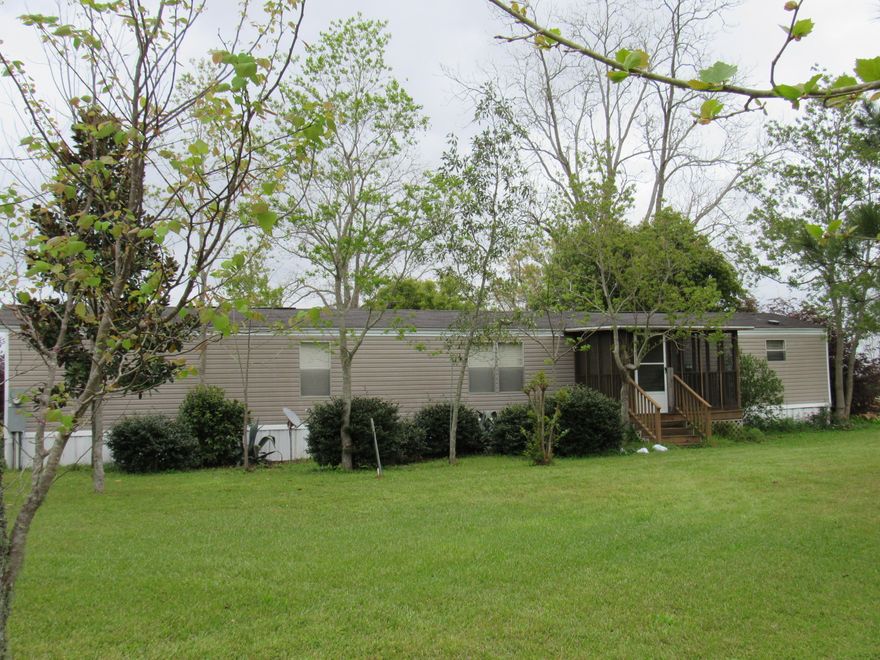 Drastically Reduced!
Beautiful, well kept and fully furnished home on 4+ acres in the Country!
Don't miss the opportunity to own this homestead that consists of 4+ acres with multi-family zoning!This well kept 2/2 home features a large master bedroom, bath and a 12x7 master closet! Complete with a screened-in back porch addition that over looks the property. This property is well manicured and reminiscent of a park! One quarter acre has a fully irrigated garden area, there are also two sheds and a carport. The tractor and farm implements could be purchased and are also negotiable. This property is part of the D.E. Murphy Addition and was platted into lots.There are 16 lots on this 4 acre parcel! Unrestricted, you can bring the entire family! Don't miss out! Call for your tour toda