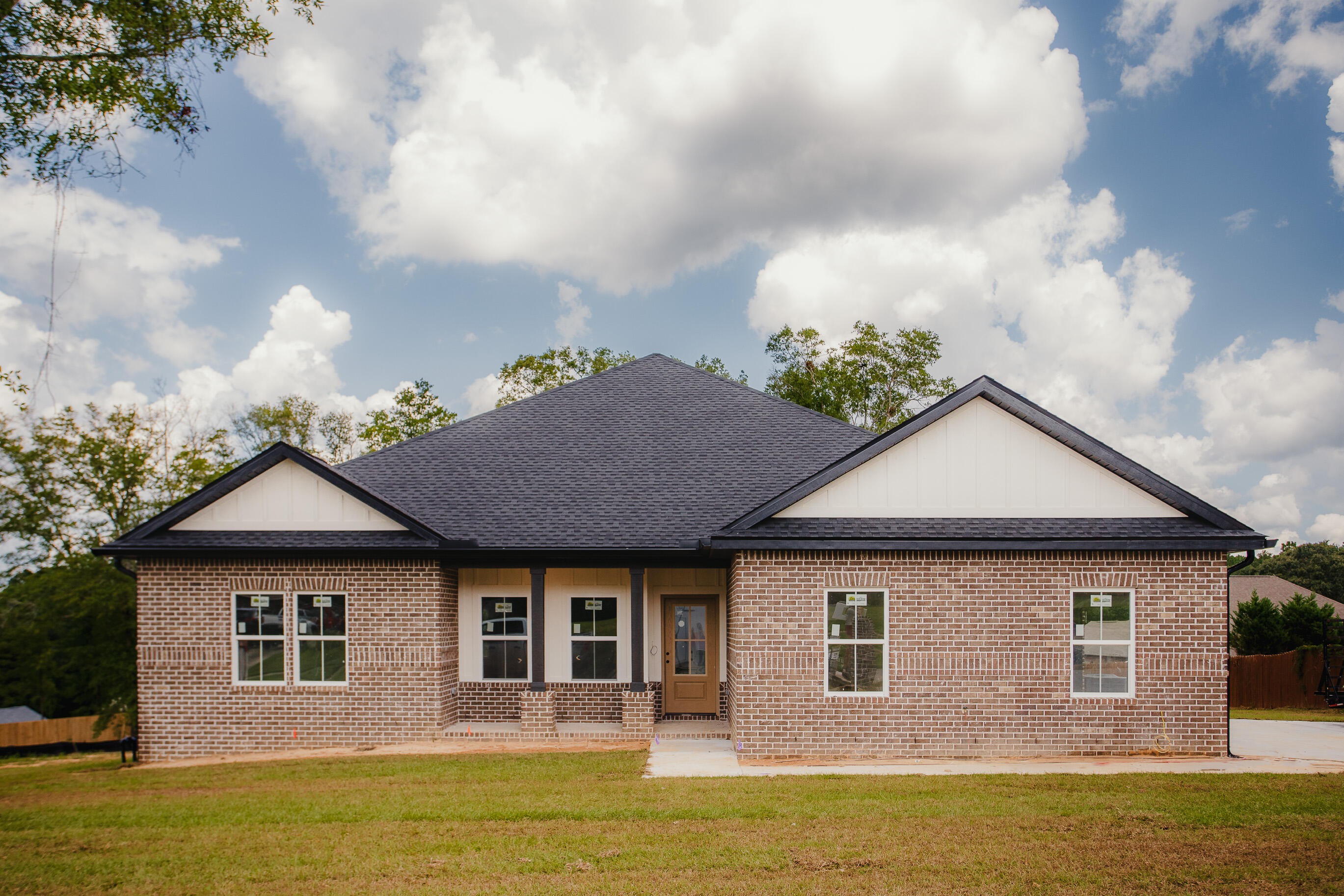 INTRODUCING VA-APPROVED NEW CONSTRUCTION, INSPIRED BY THE BUILDER'S 2024 PARADE OF HOMES AWARD-WINNING DESIGN! #TheFreedomPlanThe 4 BR/2 Bath 'Freedom Plan' is an open-concept, UPSCALE MASONRY DESIGN, WITH BRICK BANDING, expansive front and back porch, TONGUE AND GROOVE CEILINGS.. and FREE GIFTS WITH PURCHASE! #FreebiesFREEBIE #1-$10,000 BONUS CASH! Buyer can spend anyway they see fit (price reduction, interest rate buydown, fencing,etc).FREEBIE #2 - $10,000 CLOSING COST ASSISTANCE (with preferred lender).Welcome to highly sought-after Carnegie Hills, where owners enjoy daily walks, bike rides, and embrace Florida's outdoor-friendly lifestyle.Inside you'll find GRAND ARCHWAY ENTRY WITH CATHEDRAL CEILING.. designer paint, luxury vinyl plank flooring, recessed lighting, UPGRADED MOLDINGS/TRIM, and LARGE WINDOWS that flood the home with light.
The CHEF'S KITCHEN features GORGEOUS GRANITE ISLAND with shaker-style cabinetry, SOFT CLOSE DRAWERS, BUILT-INS, STAINLESS STEEL APPLIANCES, PANTRY and DELUXE-SIZED DINING AREA.
The master suite is GRAND with 2 WALK-IN CLOSETS (one in the bedroom/one in the bathroom), luxury vinyl plank (bedroom), upgraded tile flooring (bathroom), 2 granite vanities and a CUSTOM-TILED SHOWER WITH GLASS ENCLOSURE-- BIG ENOUGH FOR 2! #Stunning
The 3 remaining bedrooms also feature luxury vinyl plank, neutral paint, large windows and spacious closets.
The guest bath offers more gorgeous granite, with tub/shower combo.
Other notable mentions: LARGE LAUNDRY, 2-car garage, UPGRADED LANDSCAPING PACKAGE, FREE SURVEY, FREE HOME WARRANTY, $10,000 BONUS CASH and $10,000 CLOSING COST ASSISTANCE! Did I mention this home sits on a HALF ACRE LOT? Yep! That too!
This LOCAL BUILDER is getting a ton of buzz for good reason-- QUALITY CONSTRUCTION WITH NUMEROUS UPGRADES... AT AN AFFORDABLE PRICE!
MAKE AN OFFER TODAY... because this home is READY NOW!