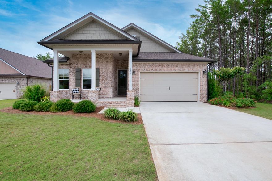 Spacious Randy Wise home in the Seasons at Hammock Bay. The Starfish plan offers an open floor plan, 3 bedrooms, 2.5 baths, flex room off the kitchen with upgraded beautiful French doors, stunning master suite with large sitting area. Other notable features include a tankless water heater, stainless Frigidaire appliances, gas cooktop, kitchen island bar, 42'' cabinets, granite countertops, wood floors, crown molding, high-end porcelain tile in wet areas, wealth of storage above oversized 2 car garage with pull down attic!
