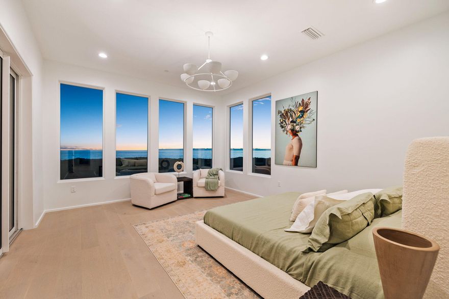 Enjoy forever unobstructed gulf views from this new never lived-in concrete fortified four-story residence, offering the perfect blend of luxurious comfort and modern convenience. Six beautiful bedrooms share six bathrooms and two half baths.  The bright and spacious home has more than 5,200 square feet of living space, including a game room as well as a breathtaking Venetian plaster foyer crafting an awe-inspiring entry to the home. This pristine custom-built home showcases the highest quality materials and workmanship. It has floor-to-ceiling windows, Carrara marble countertops, four HVAC units and a durable metal roof. Classy engineered white oak flooring and custom Italian cabinetry are laid on the second, third and fourth levels.