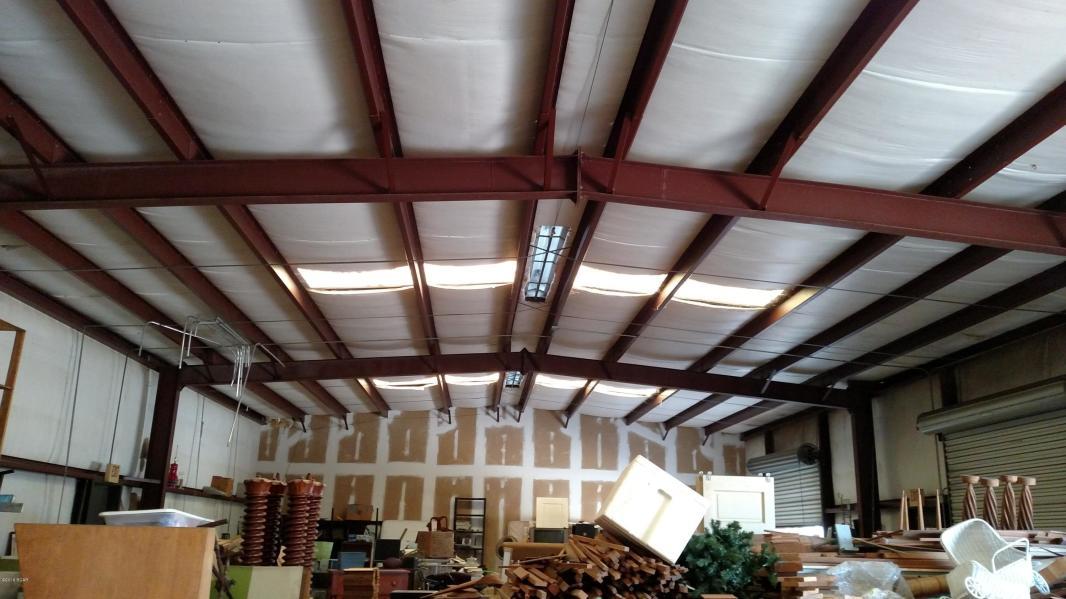 Lowest priced commercial warehouse available in Lynn Haven. Motivated seller! 3,000 square feet and perfect for storage, a small business, and centrally located in Lynn Haven right off of Highway 77. Federal Express is directly behind this warehouse. There is an enclosed area for a restroom, three bay garage doors, and a main door for entry. There is tremendous space for parking in front of the building and on the side of the common area.