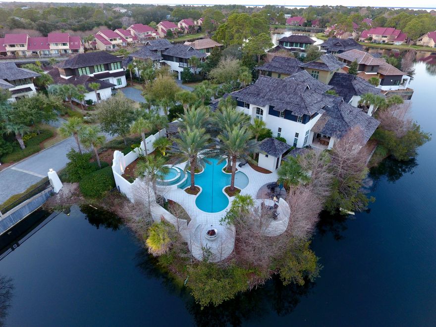 Once in a great while, a truly spectacular custom built home becomes available to purchase.Gated luxury living in Sandestin. A work of art in form and functionality. Stunning West Indies vernacular designed home that epitomizes the Emerald Coast, living in a most serene resort style setting. This private retreat expands graciously to host large-scale entertaining in and around the unsurpassed heated lagoon pool, fire pit and large hot tub. Nestled onto a small peninsula of land by Horseshoe Lake. Home features four bedrooms, five full baths and one half bath. This stucco home is complete with hardwood siding, cedar shingles, Pella wood windows, cobblestone pavers, and mahogany front door. Step inside and be greeted to wood flooring, travertine, much more!