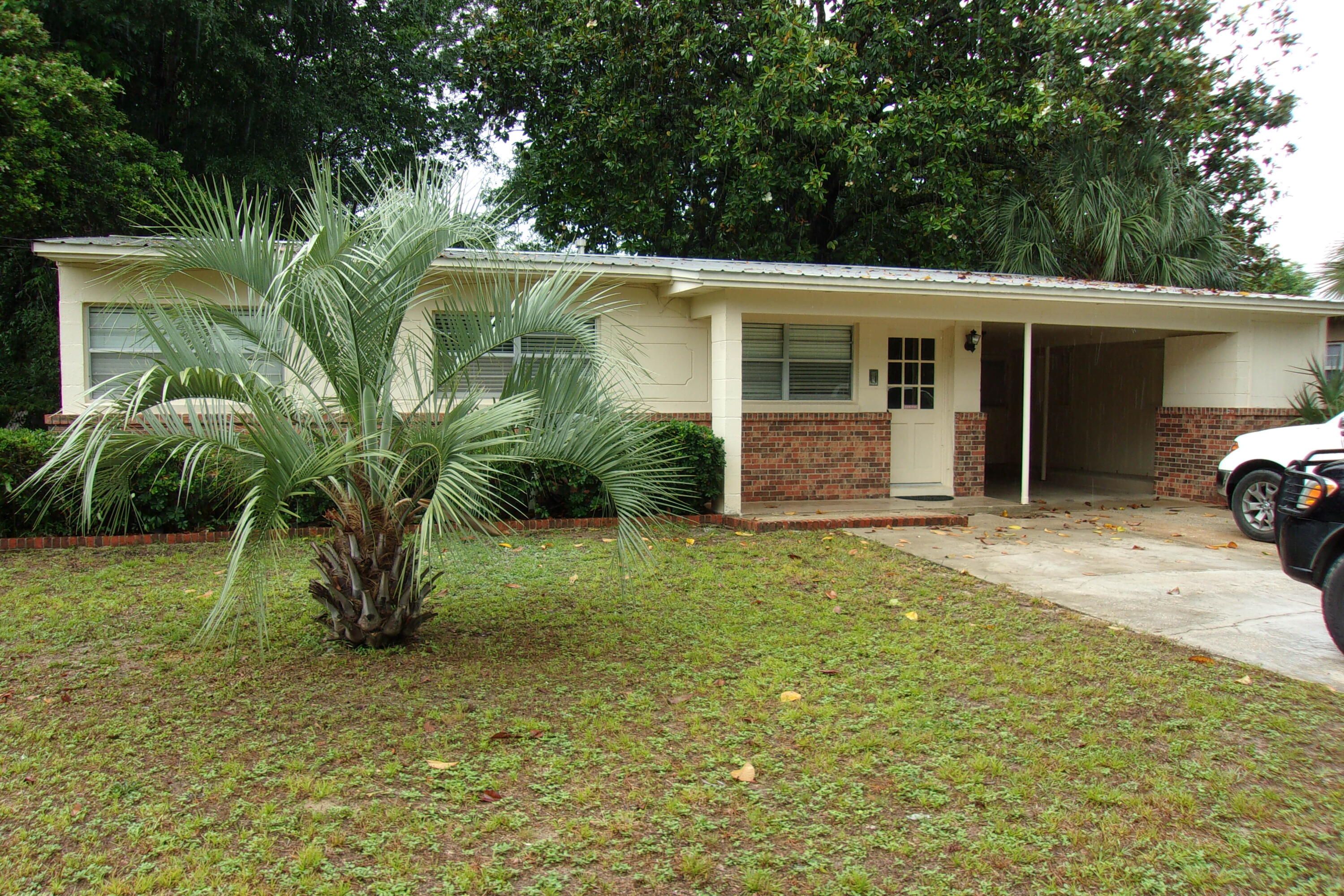 Freshly painted. three bedroom, 1 bath. Older home with great potential. Just outside City limits. Easy access to Hwy 90 East. Concrete block with metal roof. Needs TLC. Totally fenced back yard. Nice carport with storage. Seller will contribute $2500 towards flooring and water heater.