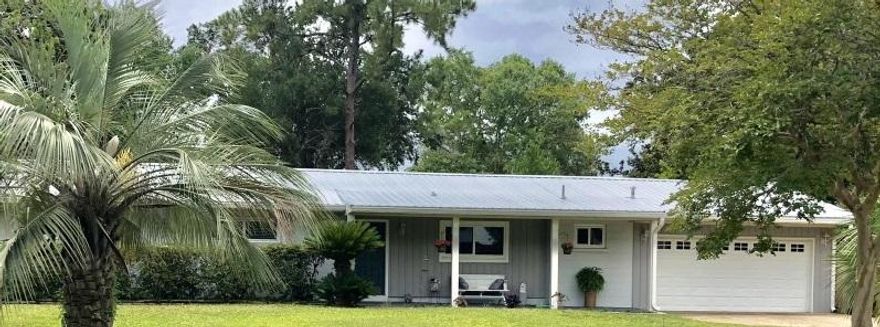A rare find in the hottest area of Ft Walton. 2000 sq ft home is walking distance to water and Yacht Club. House was renovated 2 years ago. House meets standards for best insurance rates, Impact Glass windows , New metal roof ( energy wise R 50 insulation), new bamboo flooring, tile in bathrooms and kitchen, new shaker style cabinets with soft close, fairly new appliances (2 years), gas stove and water heater, granite countertops and window ledges. Separate laundry room. Double garage, work shop, smart front door lock, 13x22 covered patio in back. Large back yard with new fence ( room for a pool). Seamless Rain gutter, Sprinkler system, enough room to park boat or RV. All windows have blinds. water view from front