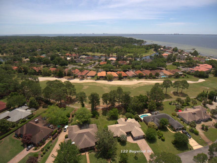 This beautiful, Bluewater Bay home is all brick and located on a large Golf course lot. This great home has been upgraded T/O with all new high end windows, renovated bathrooms in 2017, cellular blinds, crown molding, raised, textured ceilings, 2 HVAC systems, brand new paver stone driveway and walkways and brand new flooring. The lush landscaping is serviced by an in ground sprinkler system and private well water. There is a gas fireplace, dual garage doors and new garage door openers, gas forced air heat and water tank. The kitchen is large and a Chef's delight with tile, granite & stainless steel appliances. The bathrooms are of with custom tile work and touches. There is an office/ media room at the foyer. This all comes with a 1 year home warranty & A termite bond in Place !