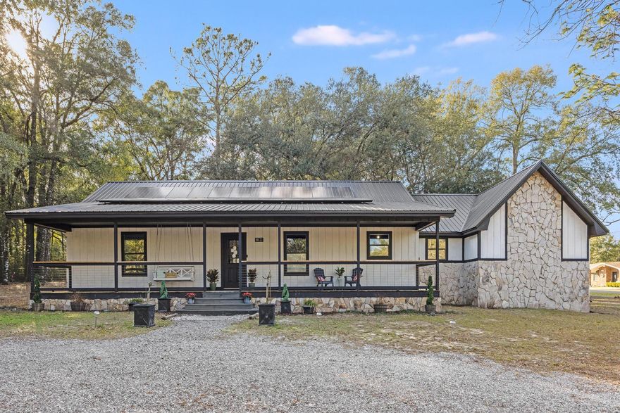 Beautiful home on a 1 acre corner lot!  New metal roof in 2021! HVAC in 2020  Solar Panels are PAID OFF!  This newly painted home has 3 bedrooms and two bathrooms in 1734 sqft of comfortable living area. Not your cookie cutter home, this one can be uniquely yours. Large, covered front porch is perfect for relaxing and enjoying the peace and tranquility.  Home has heated and cooled storage/office space in back of garage.