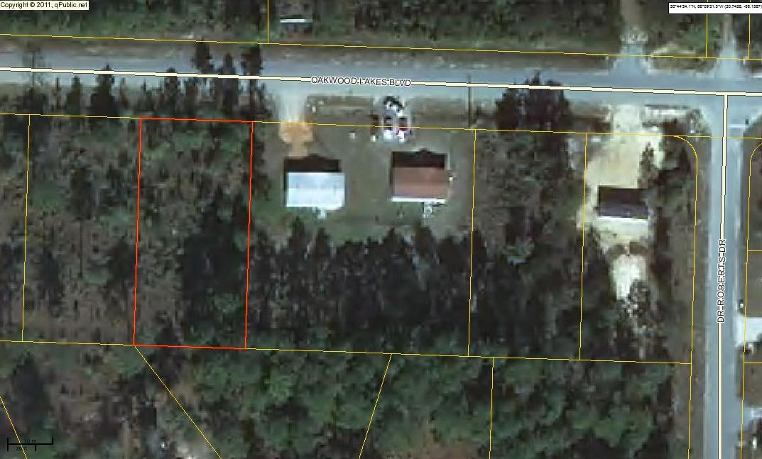 One of 4 consecutive lots on desirable Oakwood Lakes Blvd. These lots are located on a paved road just outside city limits. Tap fee and impact fee have already been paid. Power on road; will require septic tank. Make an offer on one or on all four!
