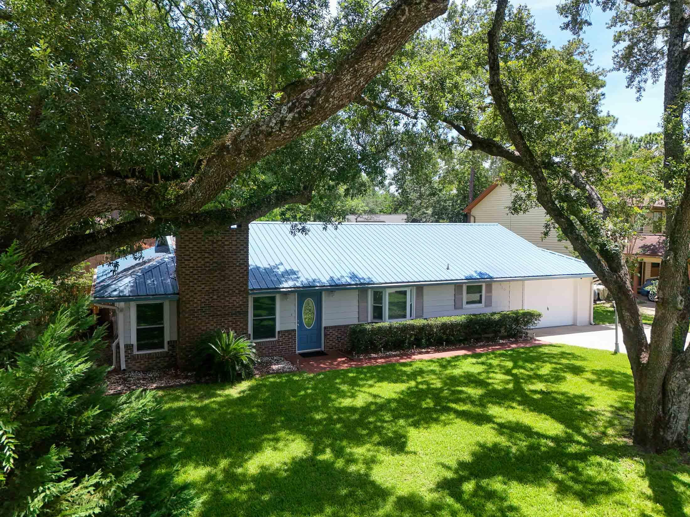 JUST LISTED! Want to be in the center of it all? This delightful 2 Bedroom, 2 Bath home with oversized 1-car Garage and adjoining Storage Room is tucked away on Cloverdale Blvd in central Fort Walton Beach and is an ABSOLUTE GEM! Cloverdale Subdivison is a charming residential area with a mix of single-family homes and townhouses. This one-level, well-maintained RANCH-STYLE SINGLE FAMILY HOME with WONDERFUL CURB APPEAL, has mature trees and landscaping, and features $50K+ in Seller upgrades! Energy efficiency, low maintenance, and comfort are KEY, with 2021-installed IMPACT RESISTANT STORM WINDOWS throughout, a 2016 METAL ROOF, 2021 HVAC & WATER HEATER REPLACEMENT, WHOLE HOUSE GUTTERS WITH LEAF-GUARD FILTERS added in 2023, new 6' WOOD PRIVACY FENCING in 2023, IRRIGATION SYSTEM with LAWN