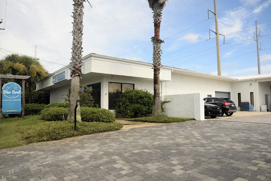 Office and small warehouse with roll up door and fenced yard. Great location with ease of access to PCB and 30A. Great frontage on PCB Parkway. 3500 sq ft of office and 1500 of warehouse. Could be altered. Adjacent to Back Beach BBQ. Available December 1st.